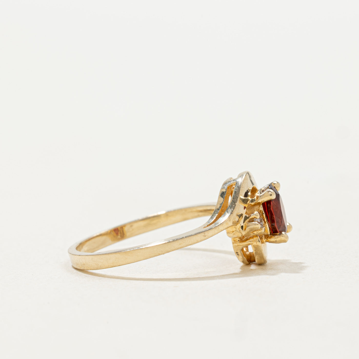 10k Oval Cut Garnet & Diamond Accented Bypass Ring | SZ 5.25