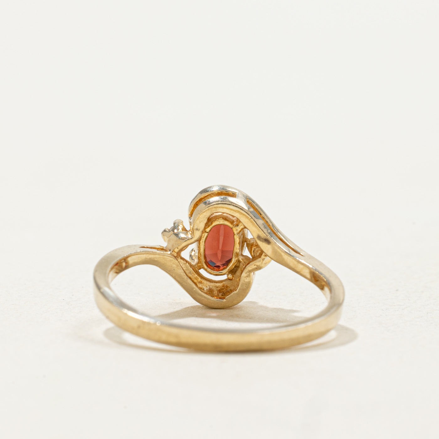 10k Oval Cut Garnet & Diamond Accented Bypass Ring | SZ 5.25