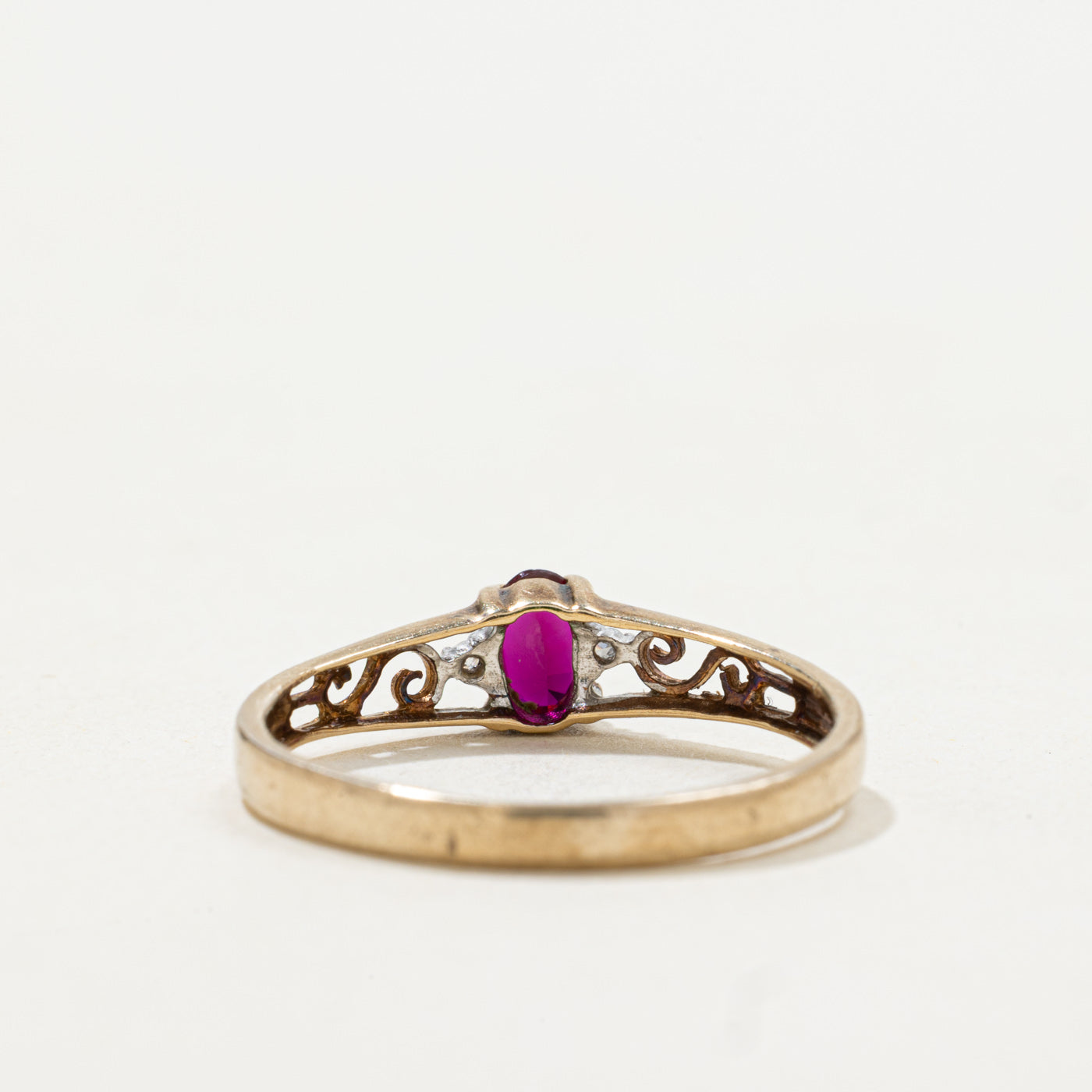 9k Oval Cut Synthetic Ruby & Diamond Accented Scrollwork Ring | SZ 6.75