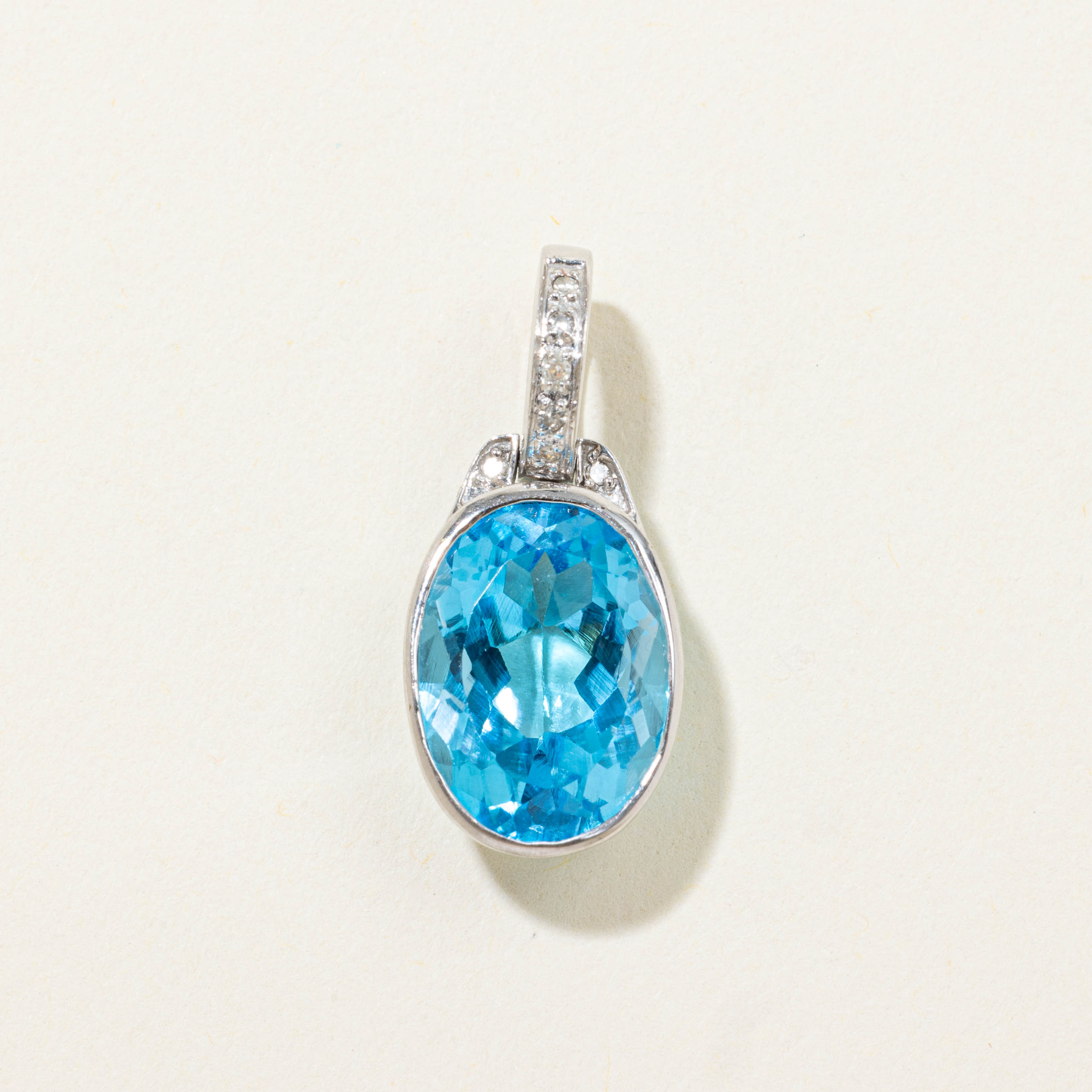10k Bezel Set Blue Topaz & Diamond Pendant | 6.50ct, 0.04ctw