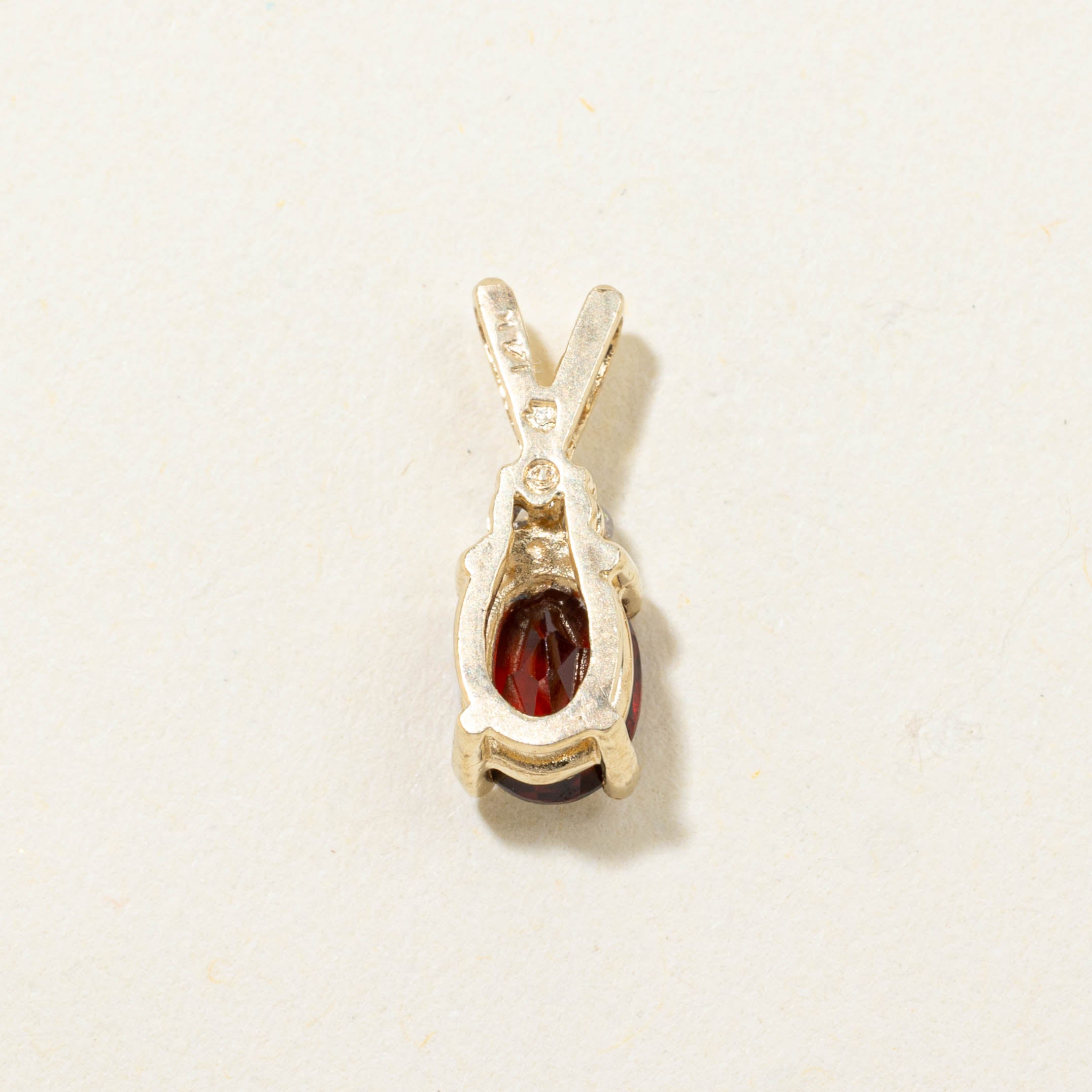 14k Oval Cut Garnet & Diamond Accented Pendant | 0.80ct, 0.02ctw