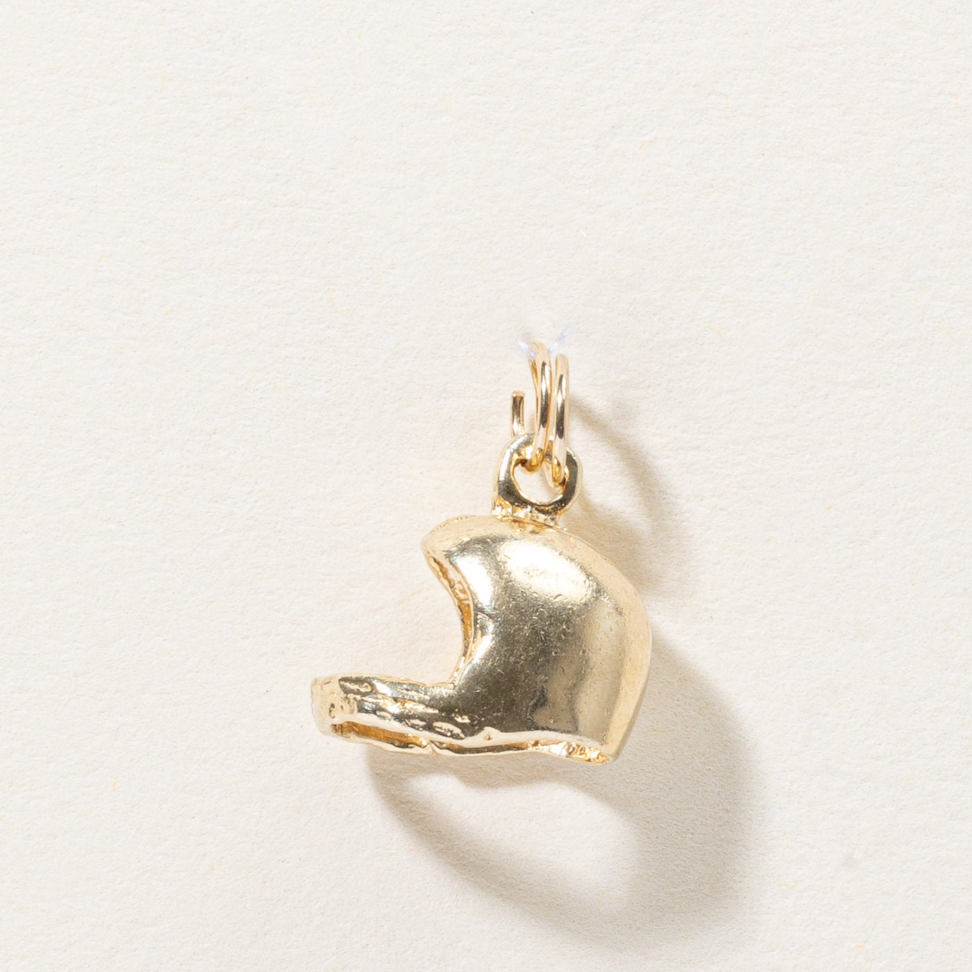 Breloque casque en or jaune 10 carats