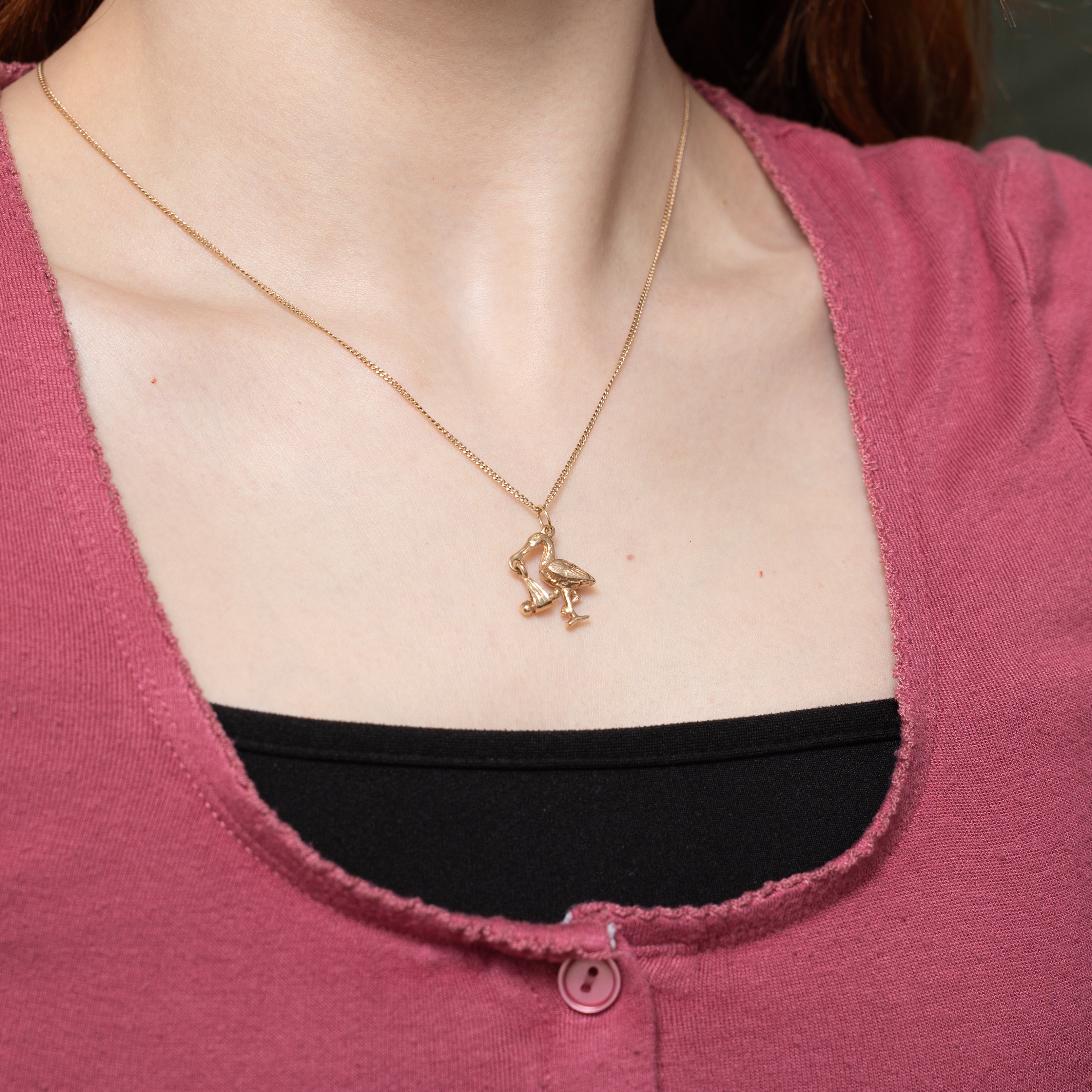 Breloque cigogne en or jaune 10 carats