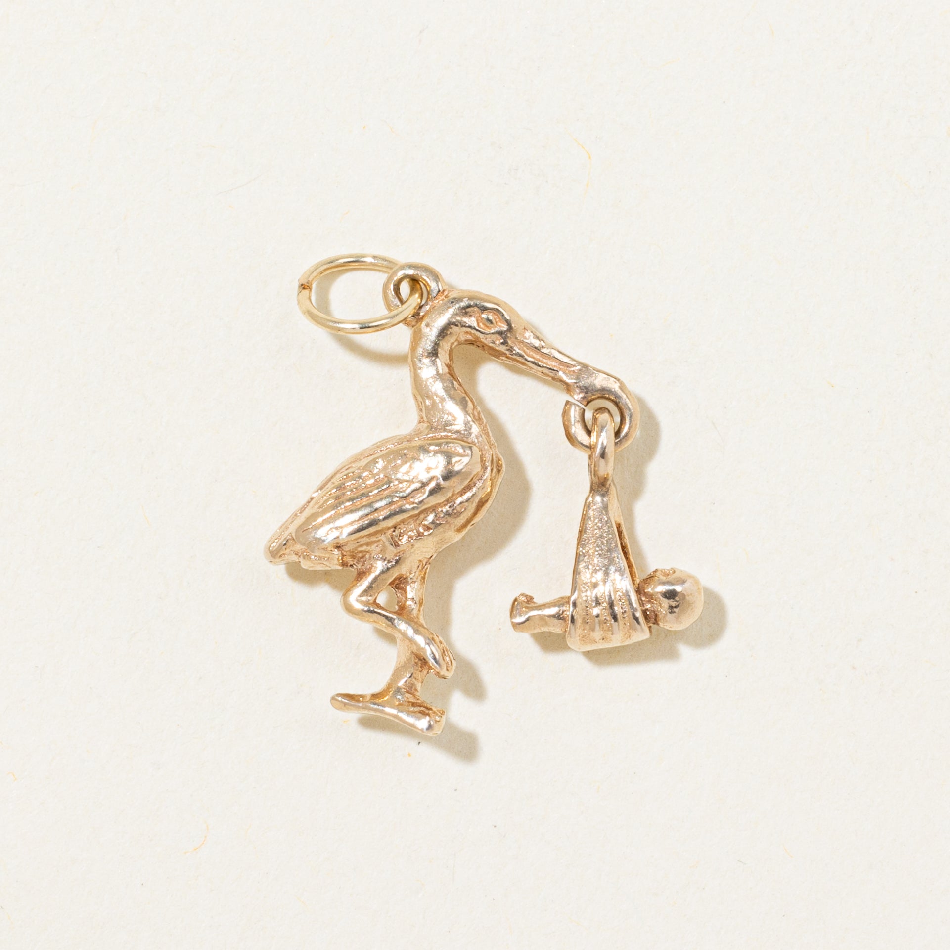Breloque cigogne en or jaune 10 carats