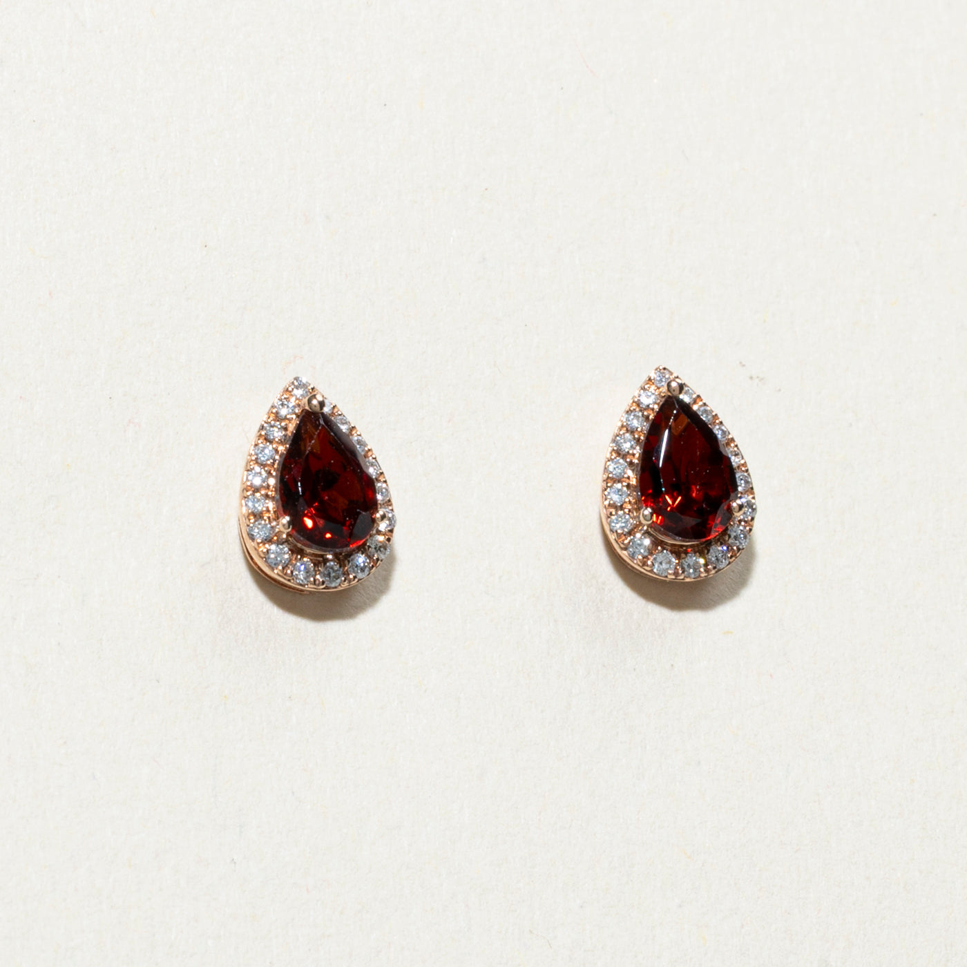 10K Pear Cut Garnet & Diamond Halo Stud Earrings | 0.90ctw, 0.04ctw
