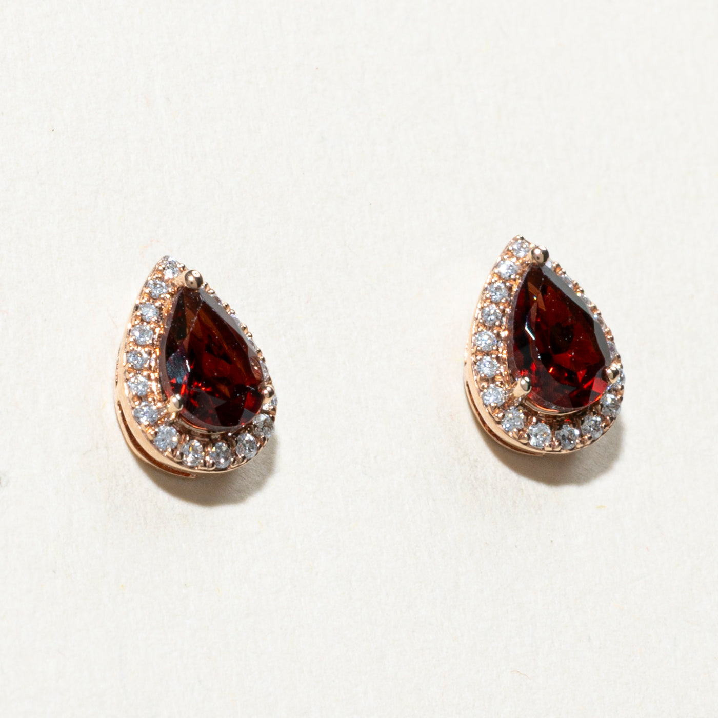 10K Pear Cut Garnet & Diamond Halo Stud Earrings | 0.90ctw, 0.04ctw