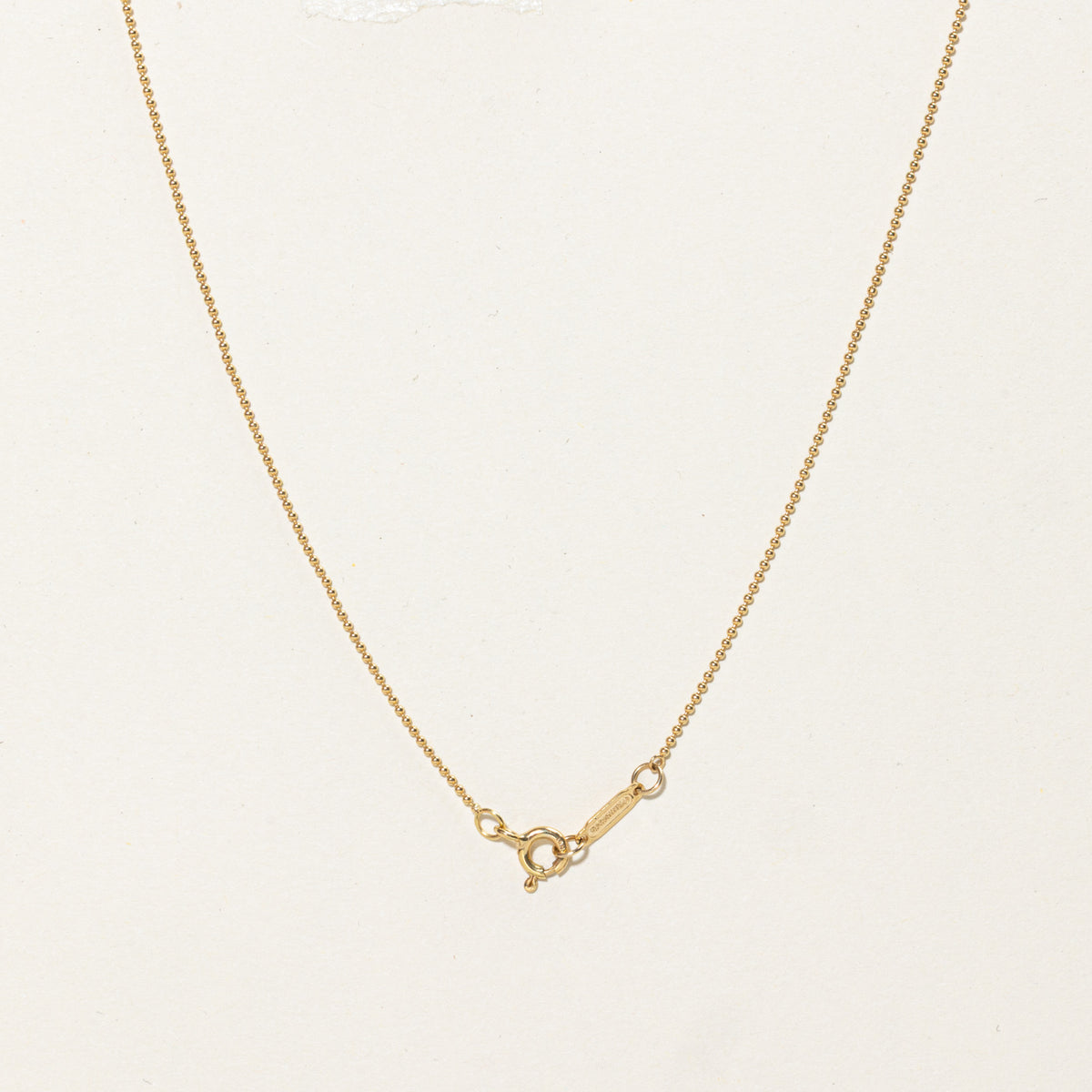 'Tiffany & Co.' Yellow Gold Oval Key Charm Necklace | 24"