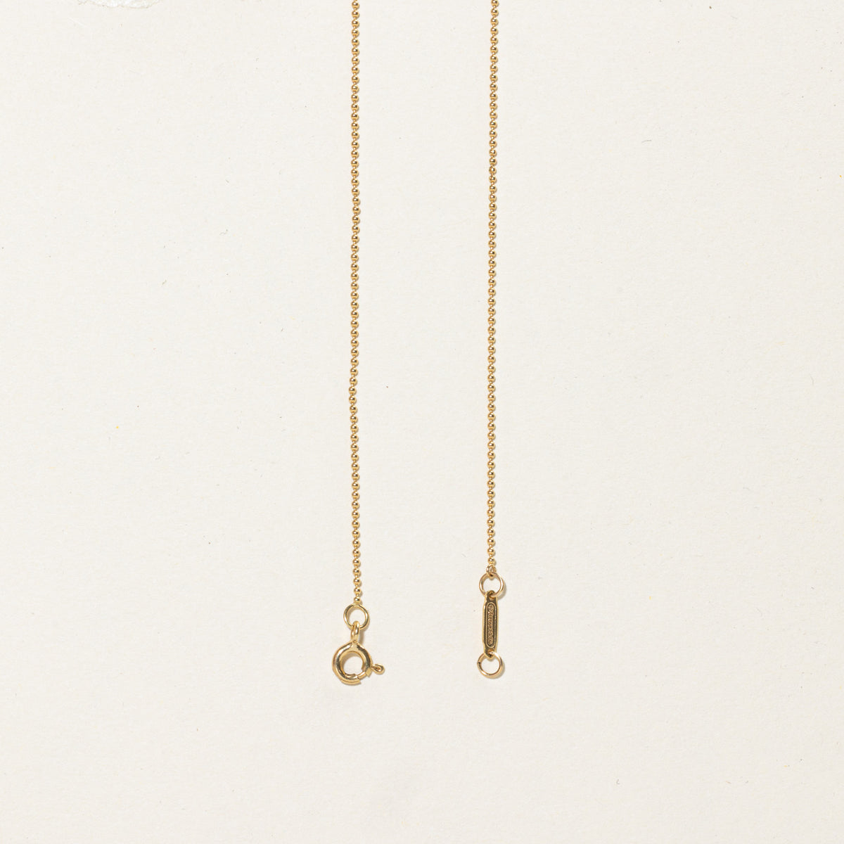 'Tiffany & Co.' Yellow Gold Oval Key Charm Necklace | 24"