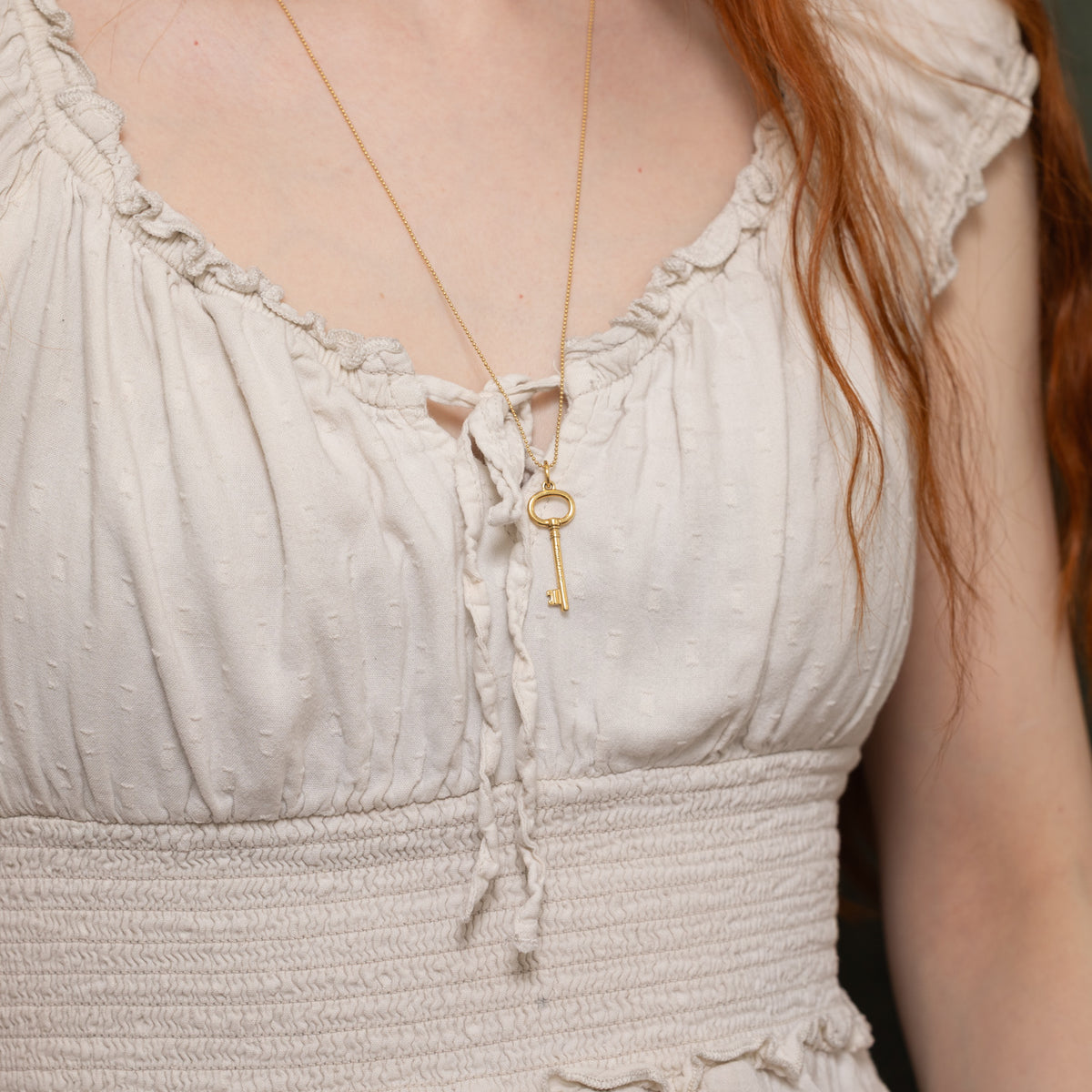 'Tiffany & Co.' Yellow Gold Oval Key Charm Necklace | 24"