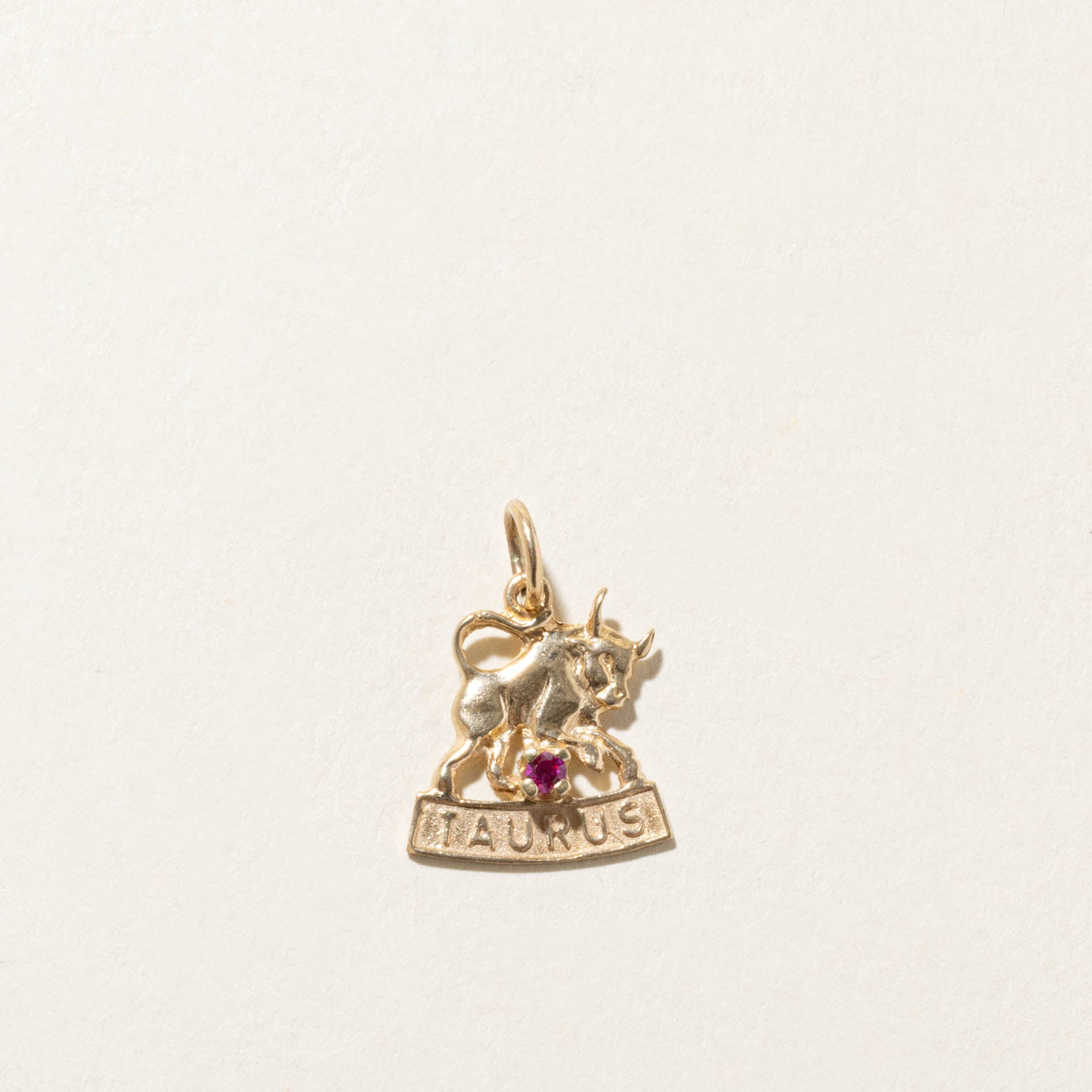 10k Synthetic Ruby Taurus Zodiac Charm
