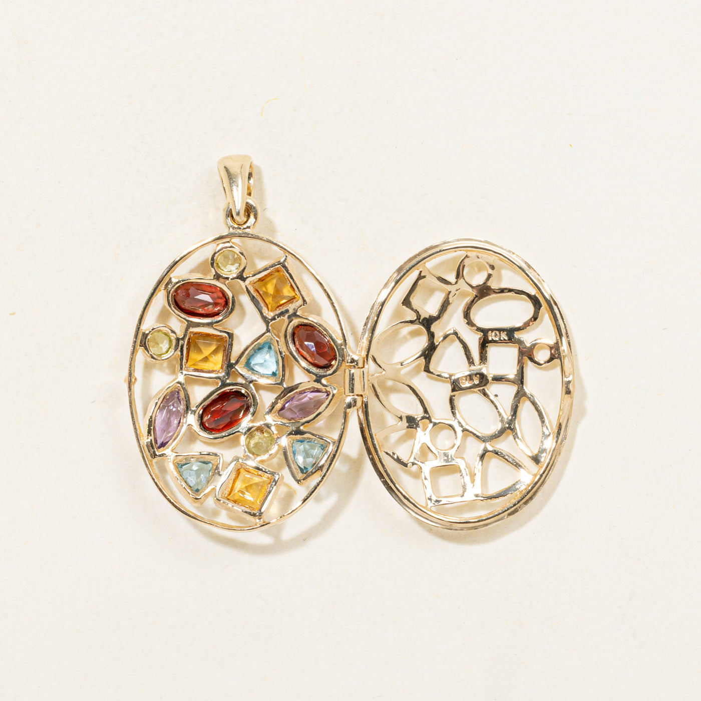 Pendentif en or 10 carats serti de plusieurs pierres précieuses | 2,00 ct au total