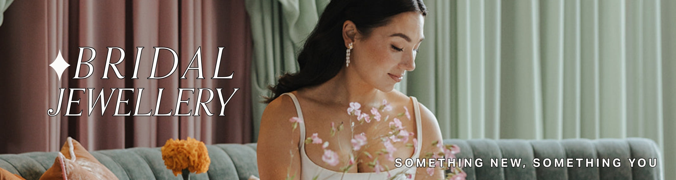 Image of bride sitting on lounge seating, holding bouquet wearing drop pearl earrings. Text overlay reads: 'Bridal Jewellery, something new, something you.'