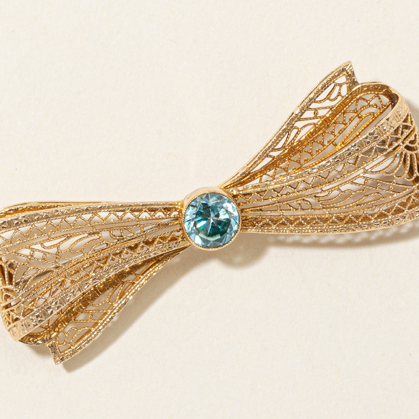 Bezel Set Blue Zircon Filigree Bow Brooch | 1.10ct