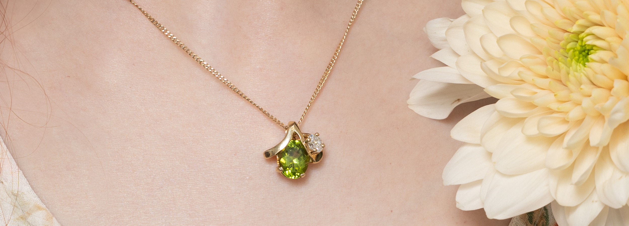 Yellow gold, vintage necklace with unique pendant design adored with peridot and diamond gemstone.