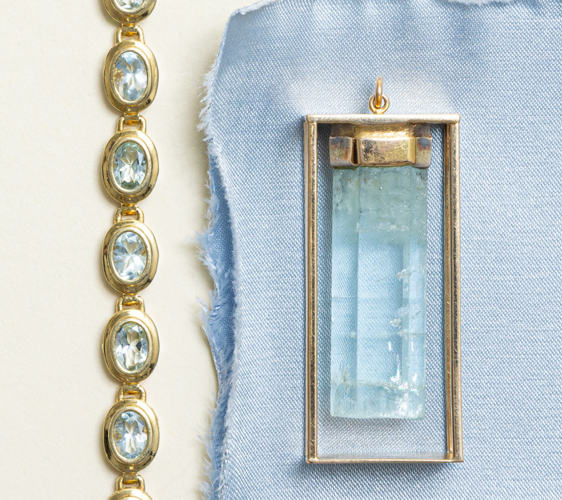 Antique aquamarine crystal pendant and oval cut aquamarine bracelet in yellow gold, March birthstone jewellery