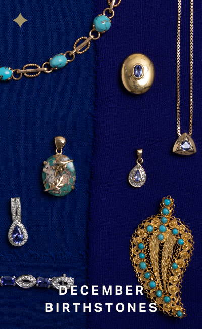 Collection of vintage, gold jewelry with turquoise and tanzanite stones on a cobalt blue textile, featuring December birthstones.