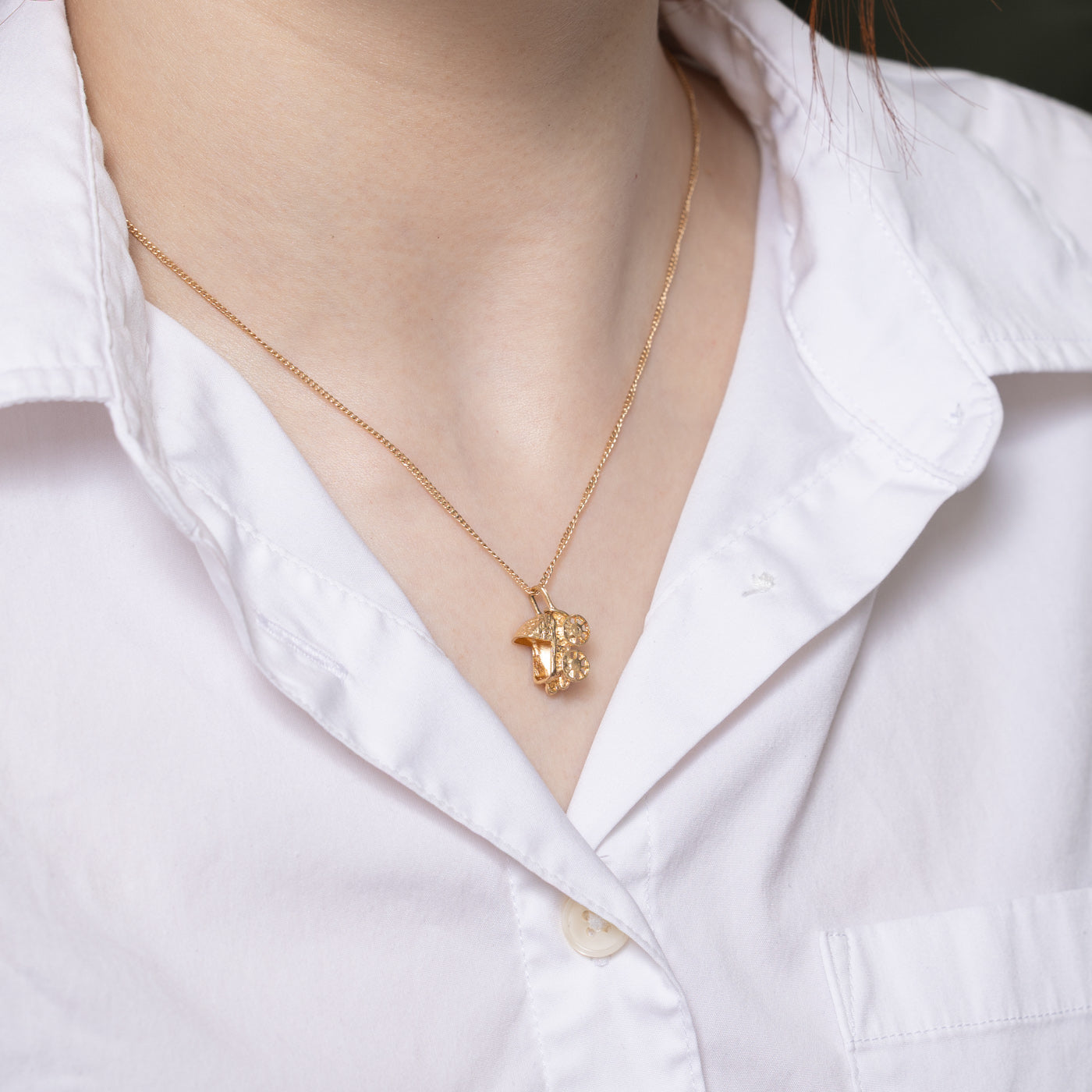 Breloque poussette en or jaune 10 carats