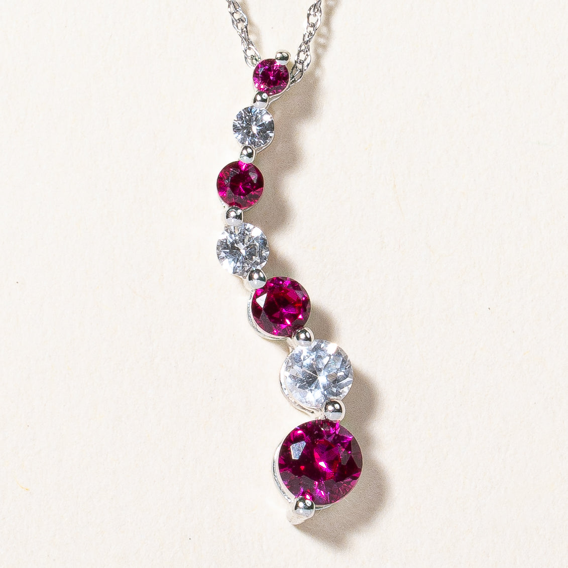 Synthetic Ruby & Colourless Sapphire Pendant Necklace | 0.35ctw, 0.25ctw | 18" |