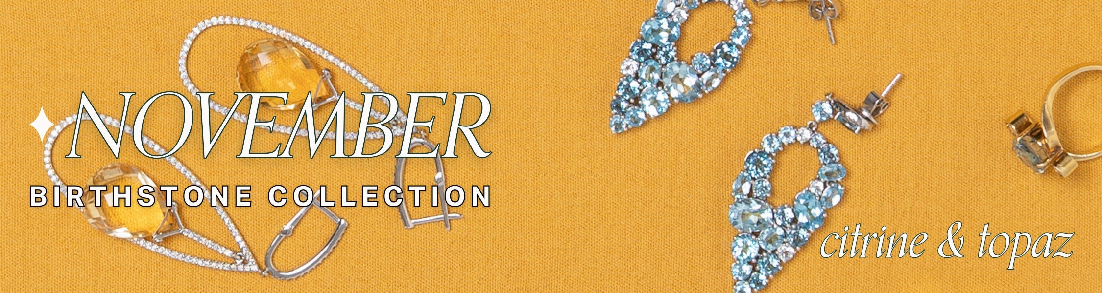 Earrings with topaz and citrine gemstones on a mustard yellow fabric background, featuring text overlay: November Birthstone Collection, citrine & topaz