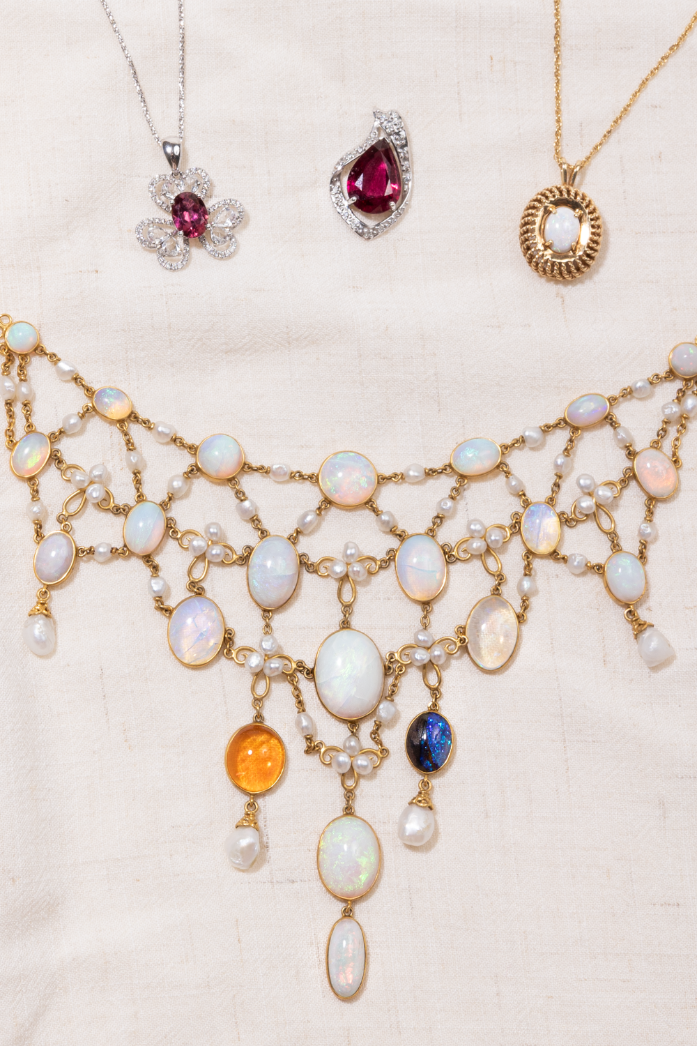Ornate, detail opal and pearl statement necklace styled with vintage, opal and pink tourmaline necklace and pendant jewellery