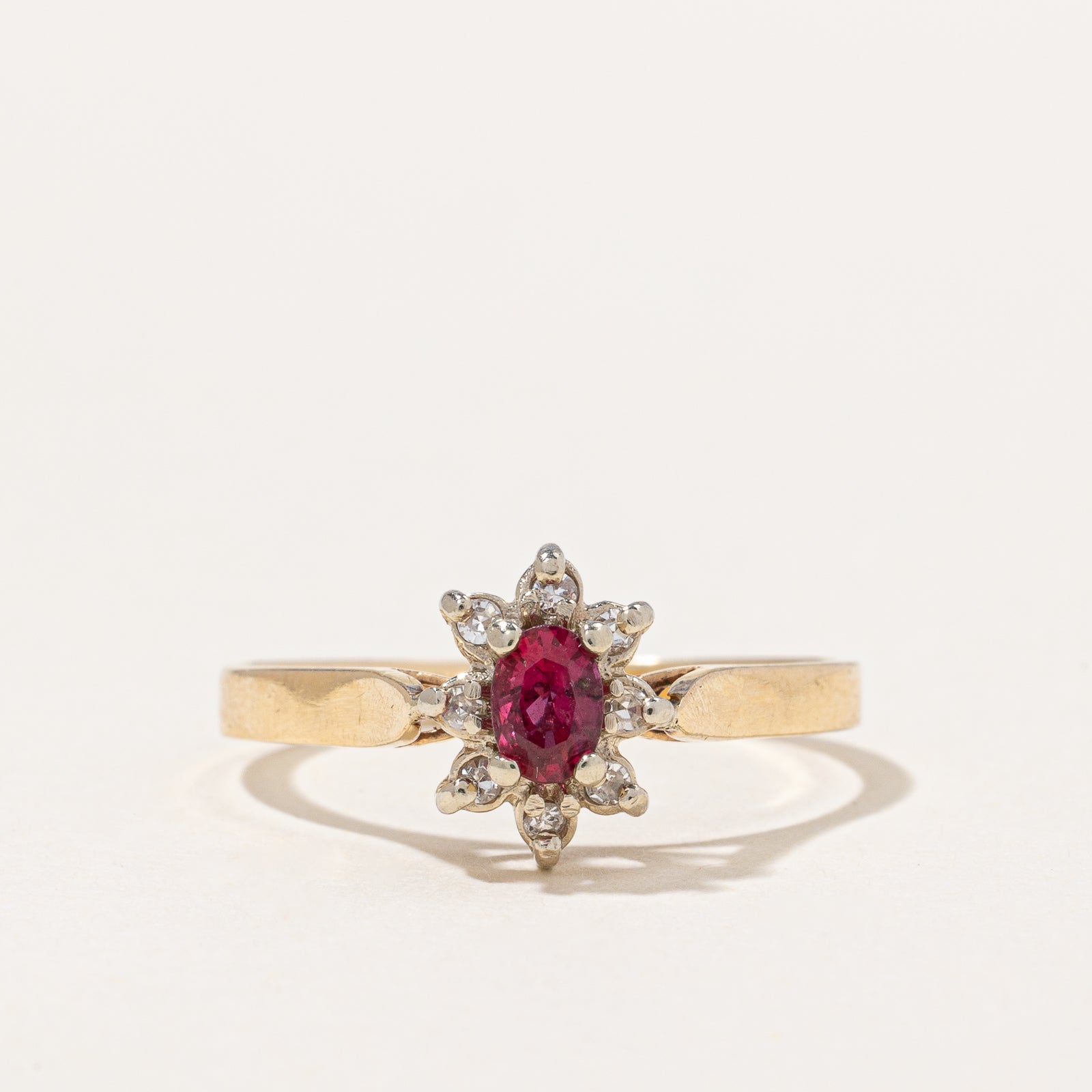 Ruby & Diamond Halo Ring | 0.25ct, 0.06ctw | SZ 7.75 |