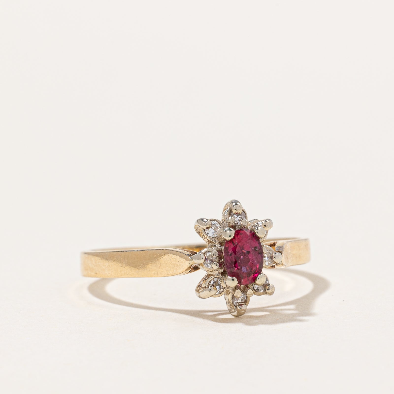 Ruby & Diamond Halo Ring | 0.25ct, 0.06ctw | SZ 7.75 |