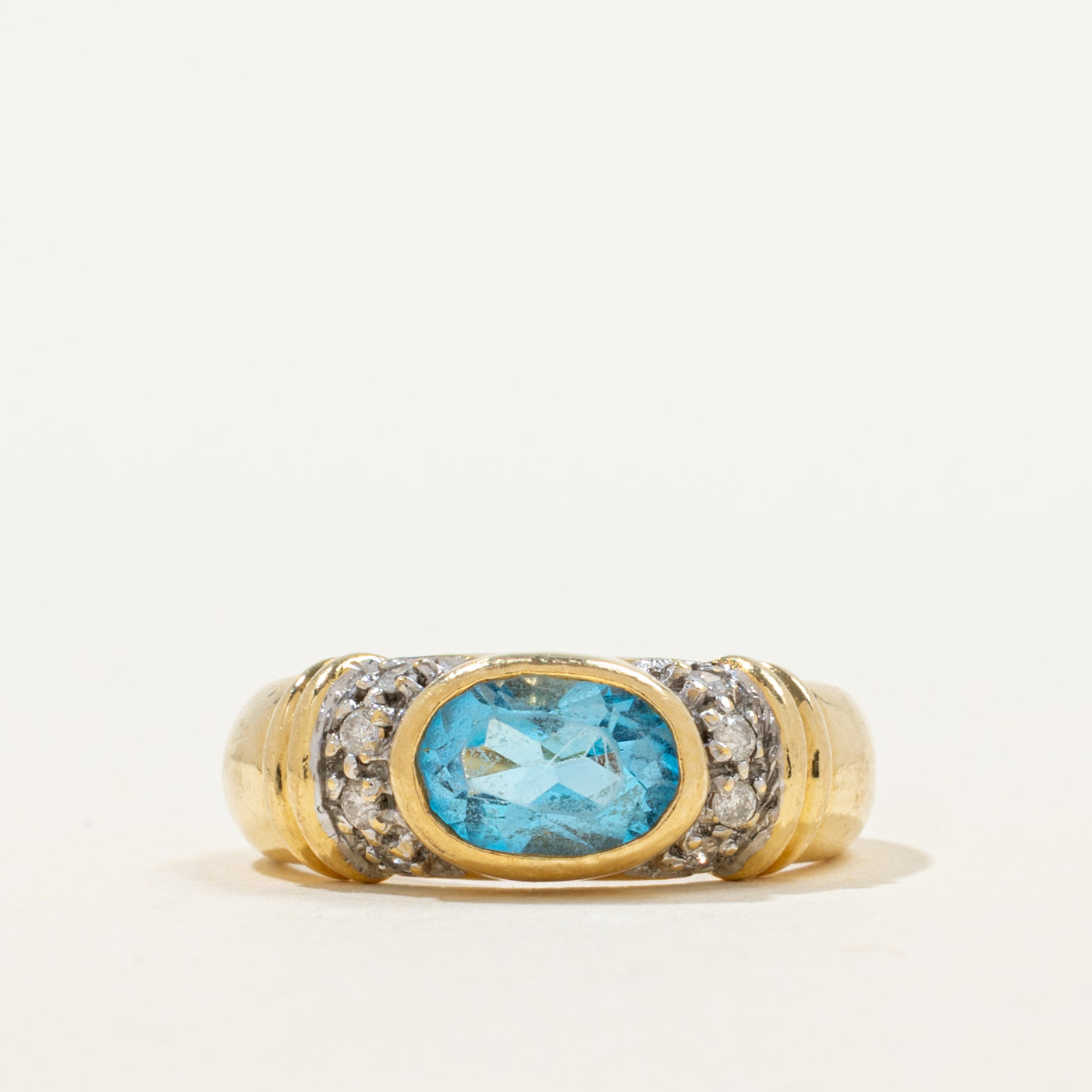East West Bezel Set Blue Topaz Ring | 0.88ct, 0.06ctw | SZ 6.25 |