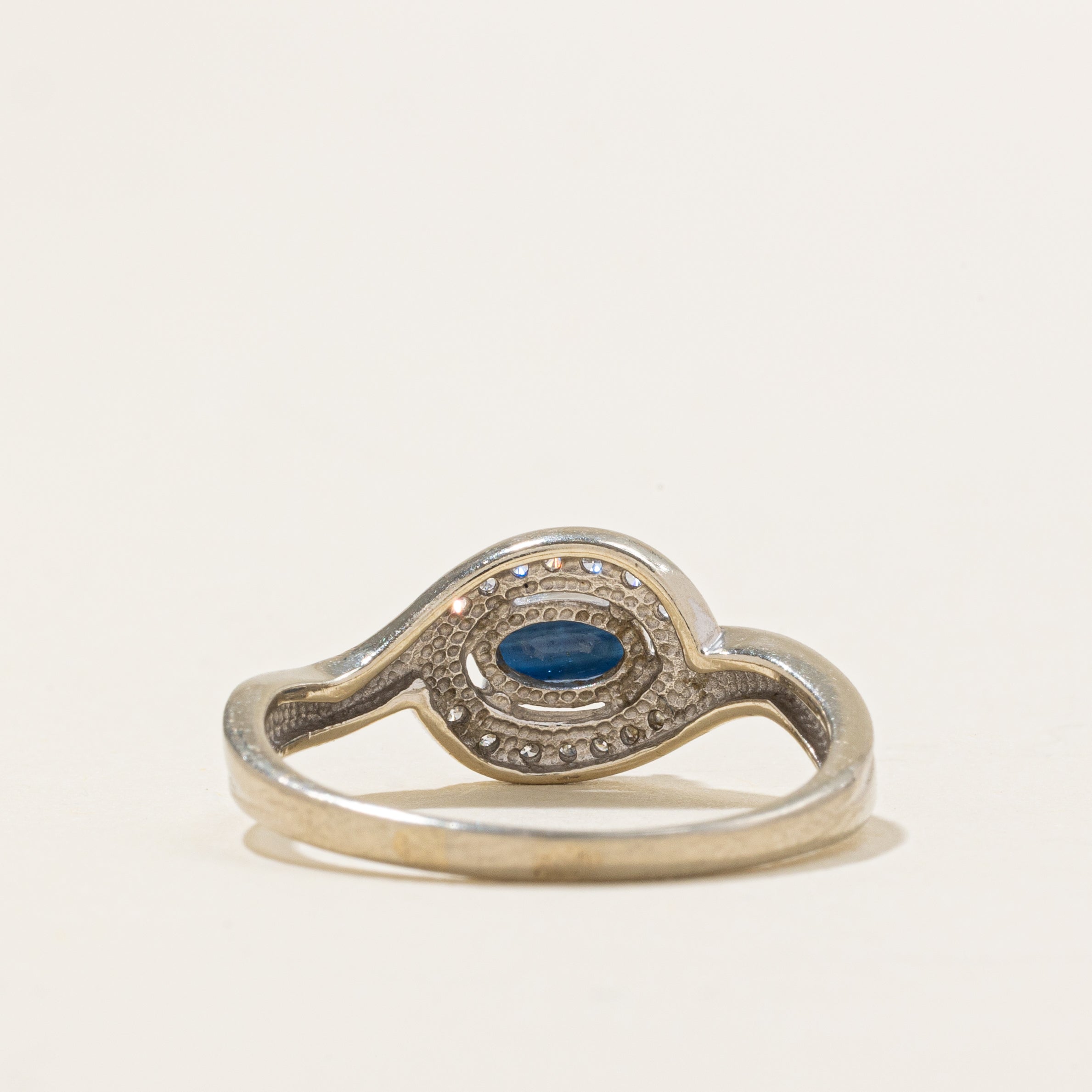 East West Sapphire & Diamond Halo Bypass Ring | 0.55ct, 0.08ctw | SZ 7.75 |