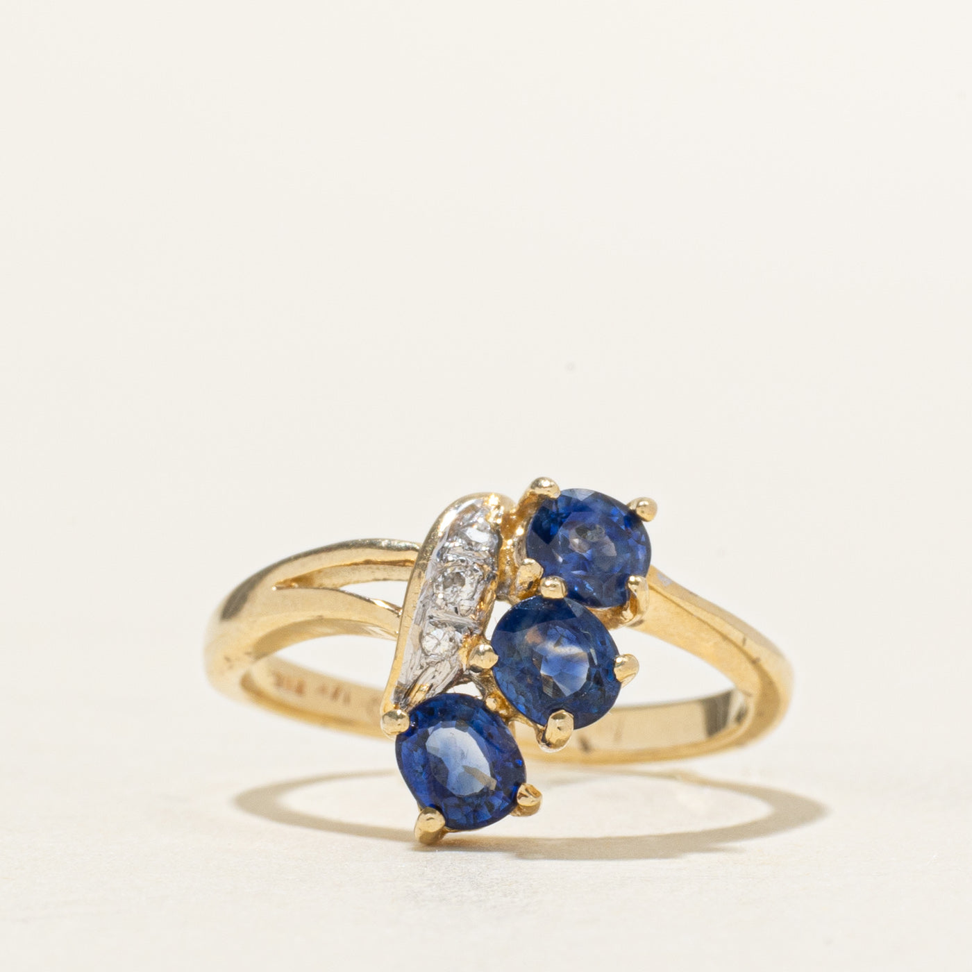 Oval Cut Three Stone Sapphire & Diamond Bypass Ring | 0.80ctw, 0.03ctw | SZ 4.25
