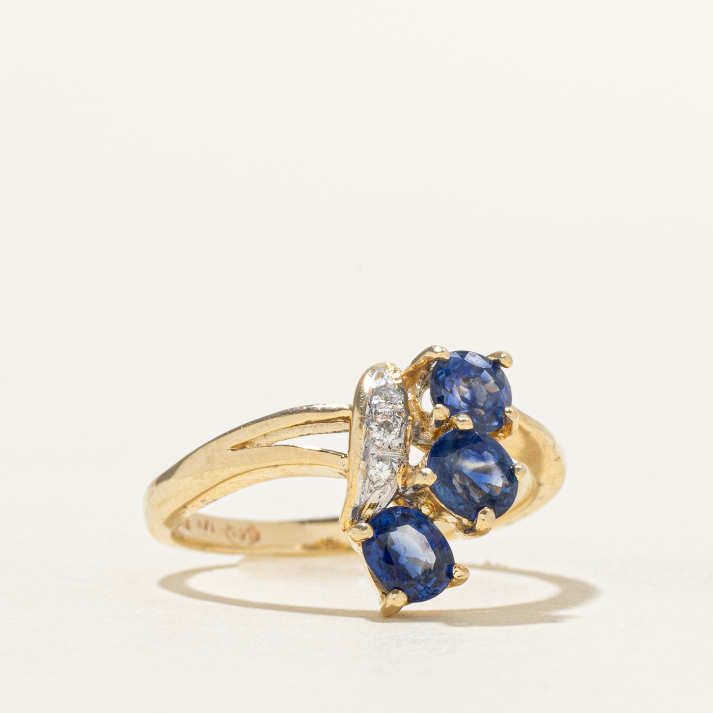 Oval Cut Three Stone Sapphire & Diamond Bypass Ring | 0.80ctw, 0.03ctw | SZ 4.25