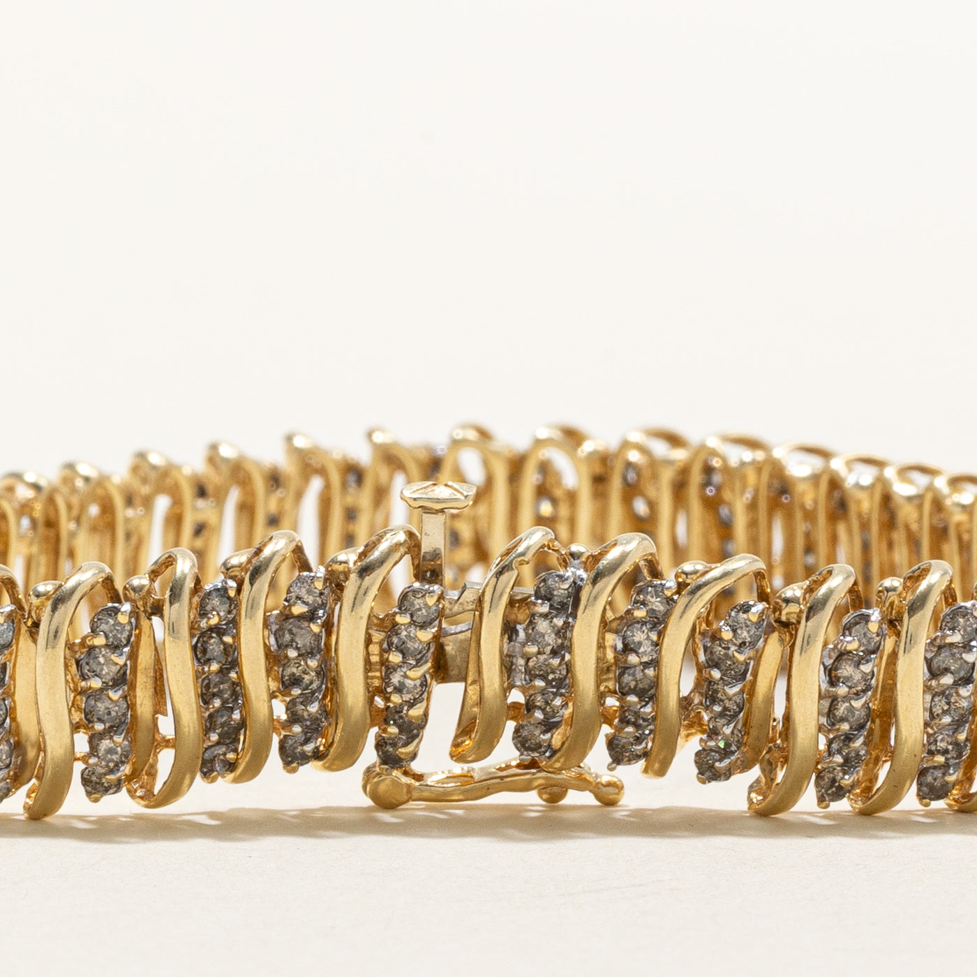 Bracelet tennis en or 14 carats serti de diamants tourbillonnants | 1,00 ct au total | 18,4 cm