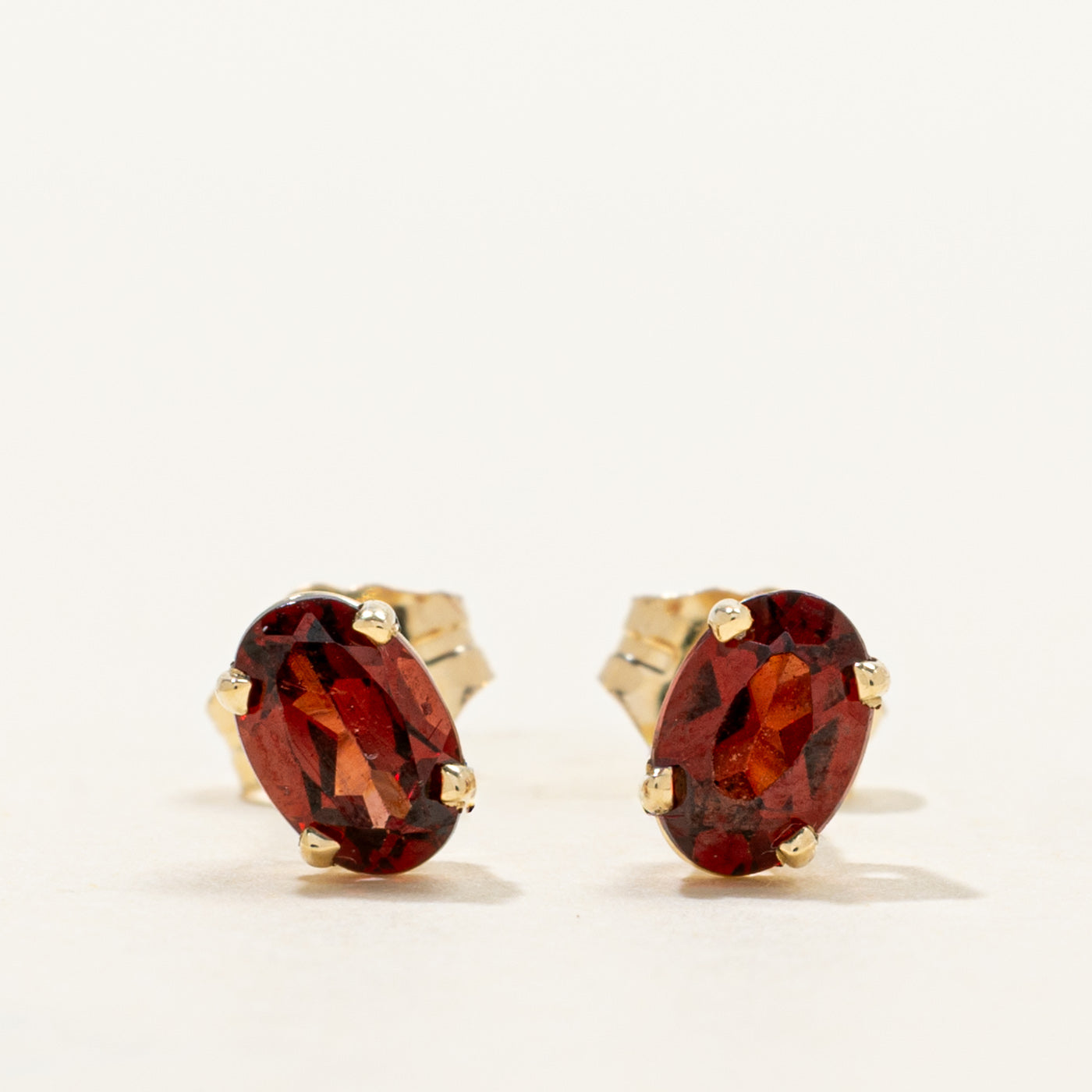 '100 Ways' Oval Cut Garnet Solitaire Stud Earrings | 1.05ctw