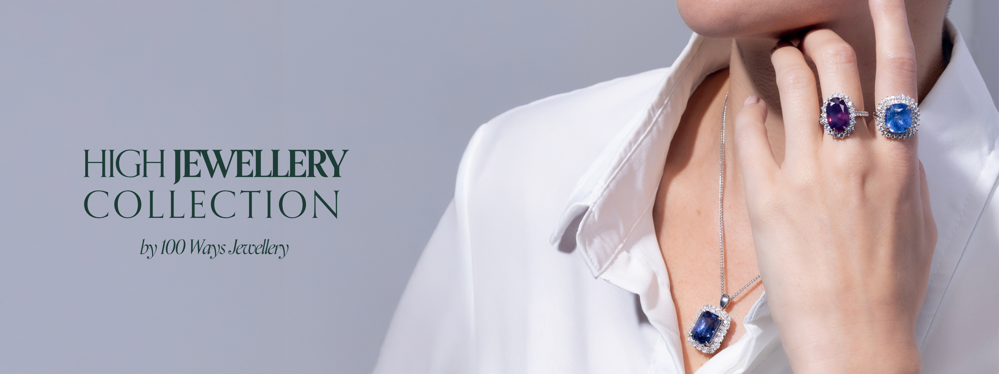 High jewellery collection by 100 Ways Jewellery with model wearing luxurious, heirloom worthy rings with large, exquisite rare gemstones and large, gemstone encrusted pendant necklace.