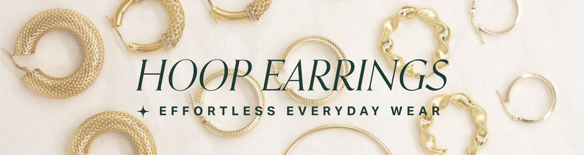 Gold hoop earrings displayed on a light background with text 'hoop earrings' and 'effortless everyday wear'.