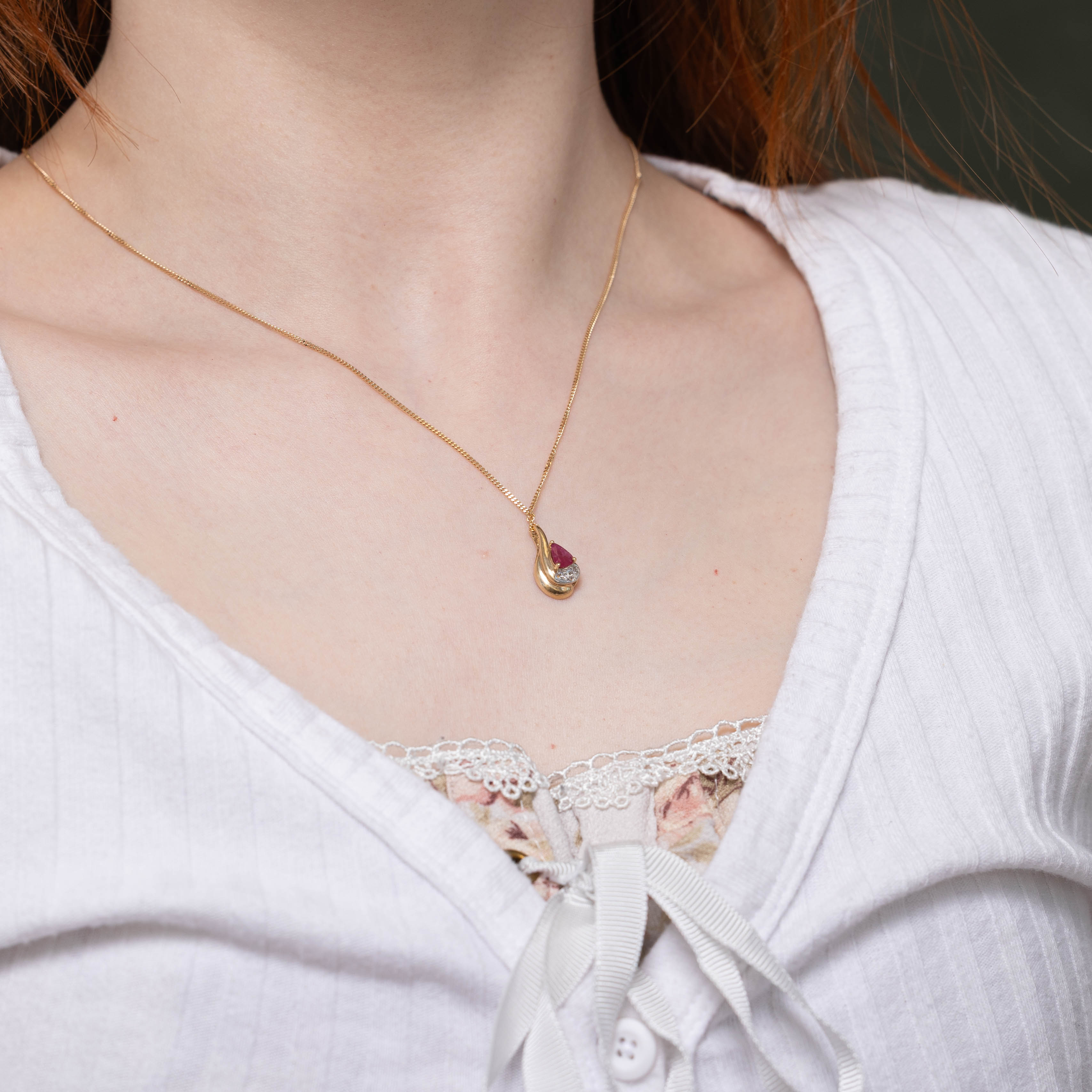 10k Pear Cut Ruby & Diamond Accented Pendant