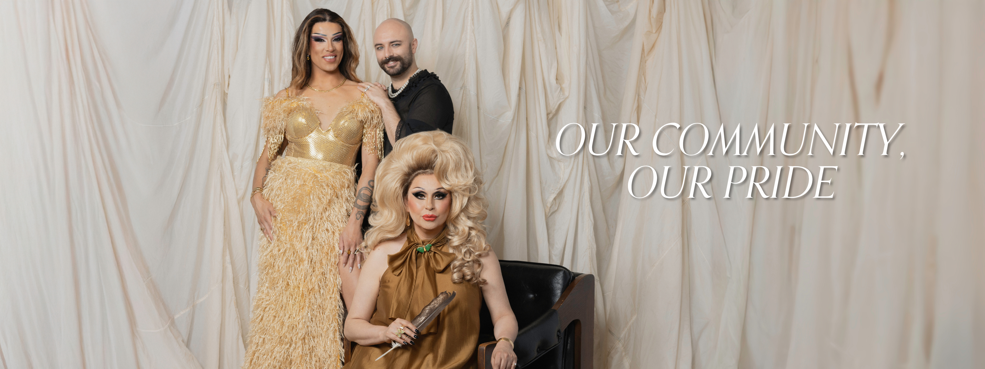 Group portrait of diverse LGBTQ2S+ community members, Kendall Gender, Evan Clayton, Jaylene Tyme, dressed in gold and glam vintage jewelry and attire for Vancouver Pride Collection. Celebrating individuality and inclusive beauty with sustainable fashion and one-of-a-kind preloved jewelry pieces. Text reads: Our Community, Our Pride.