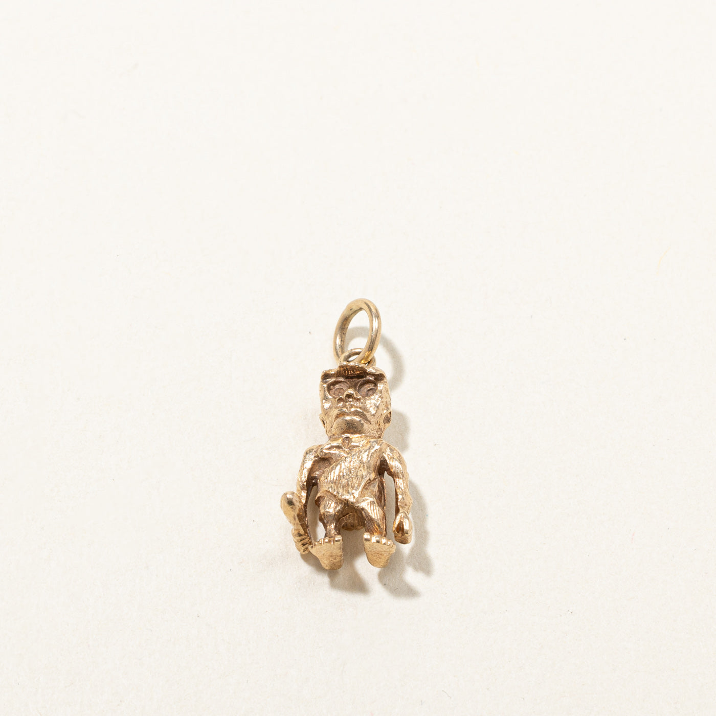 Gold Caveman Charm