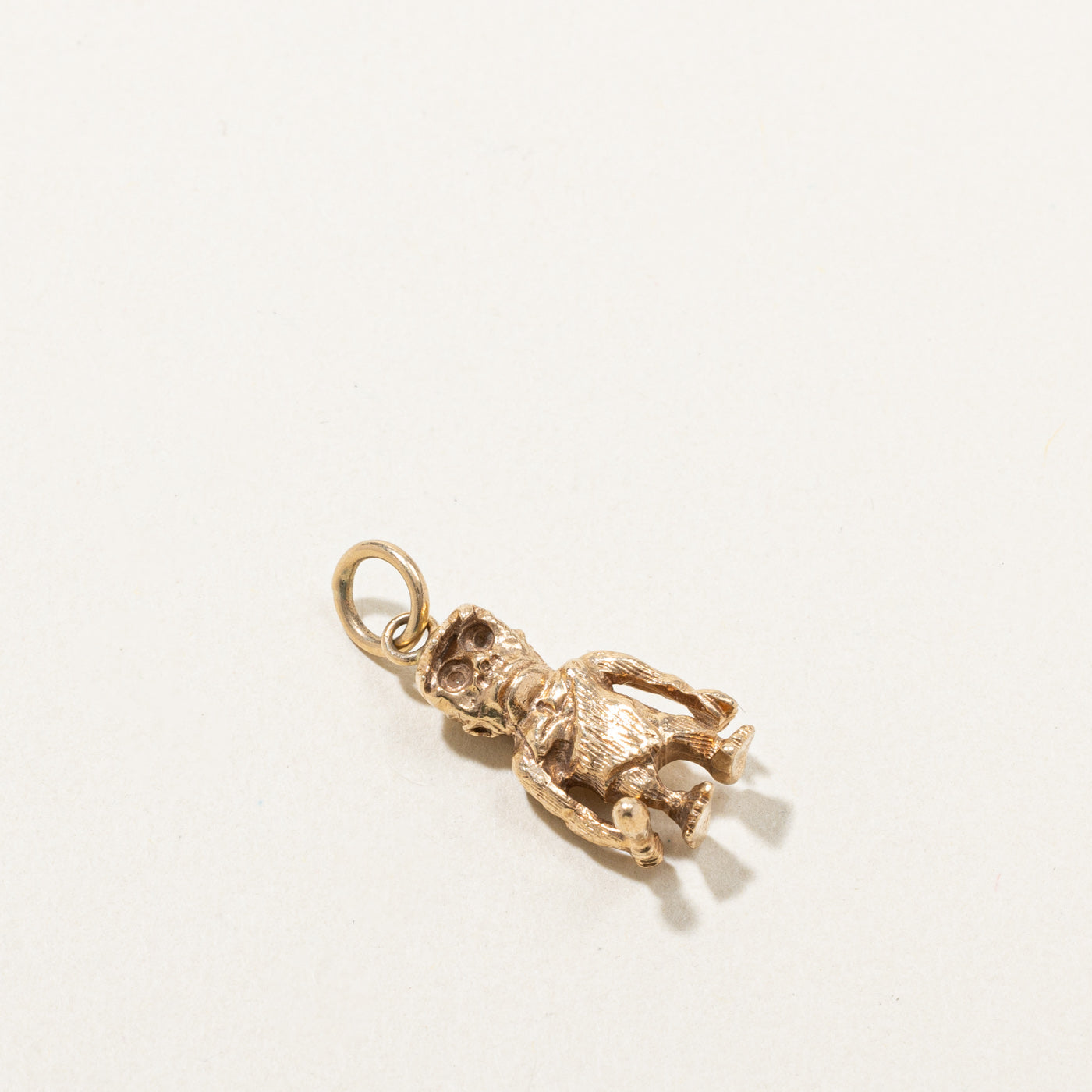 Gold Caveman Charm