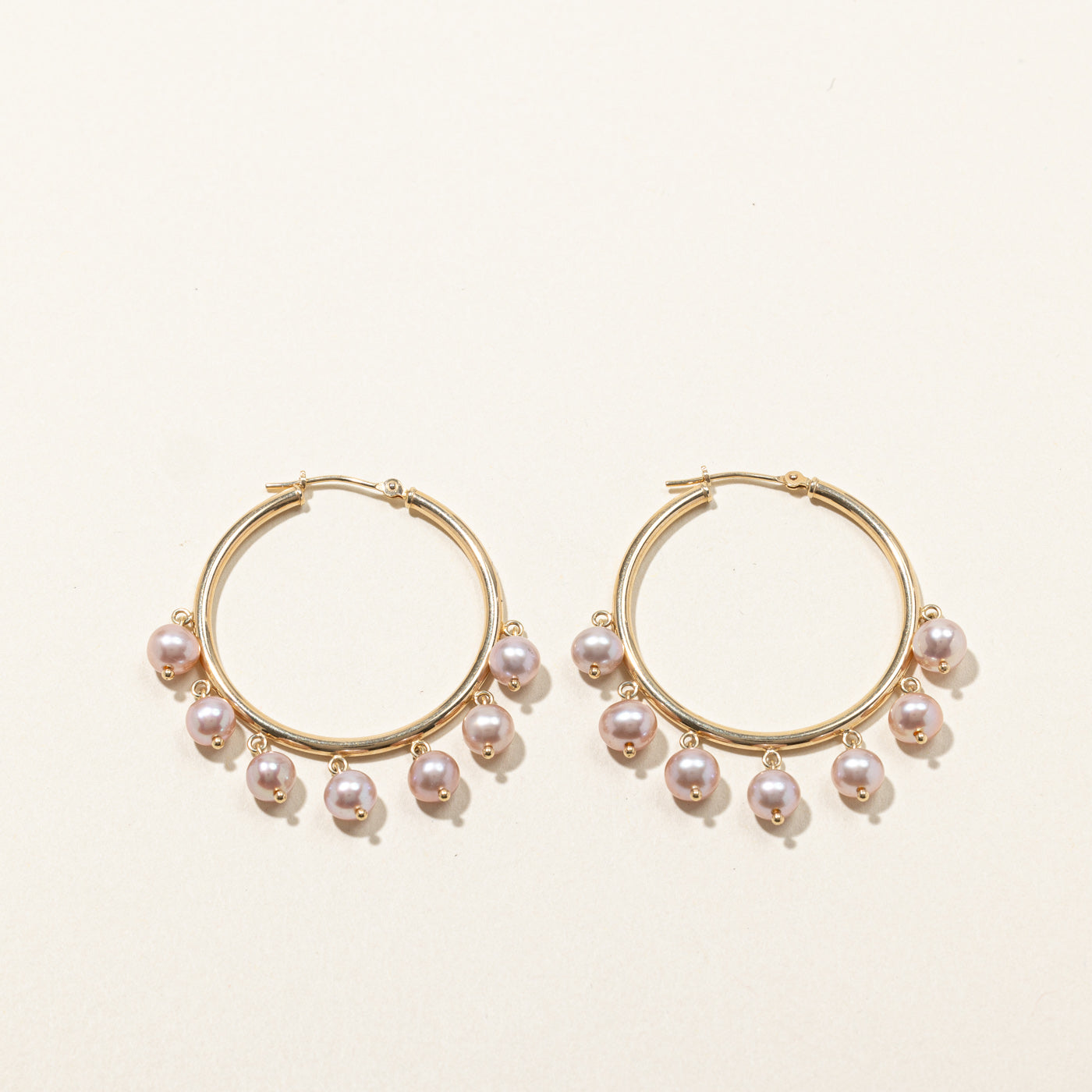 Boucles d'oreilles créoles en perles roses
