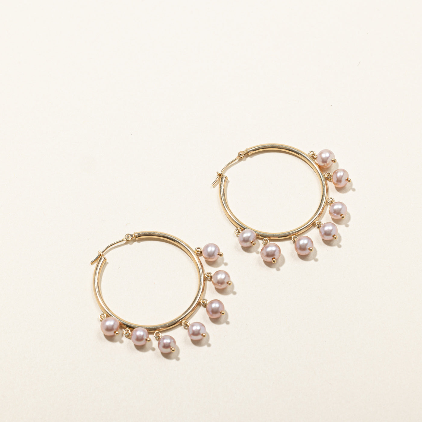 Boucles d'oreilles créoles en perles roses