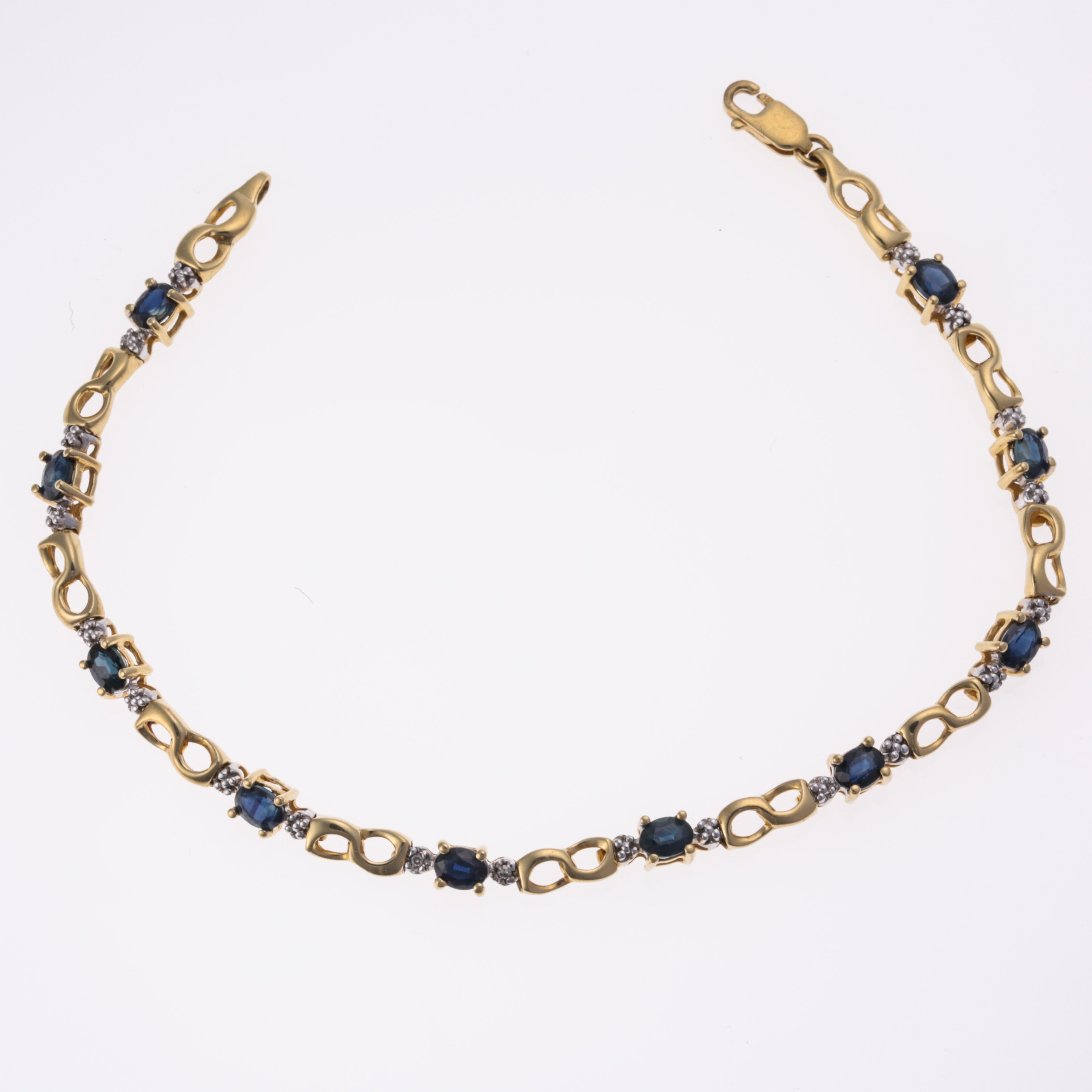 Bracelet en or jaune 14 carats, saphirs bleus et diamants | 2,60 ct au total, 0,01 ct au total | 17,8 cm |