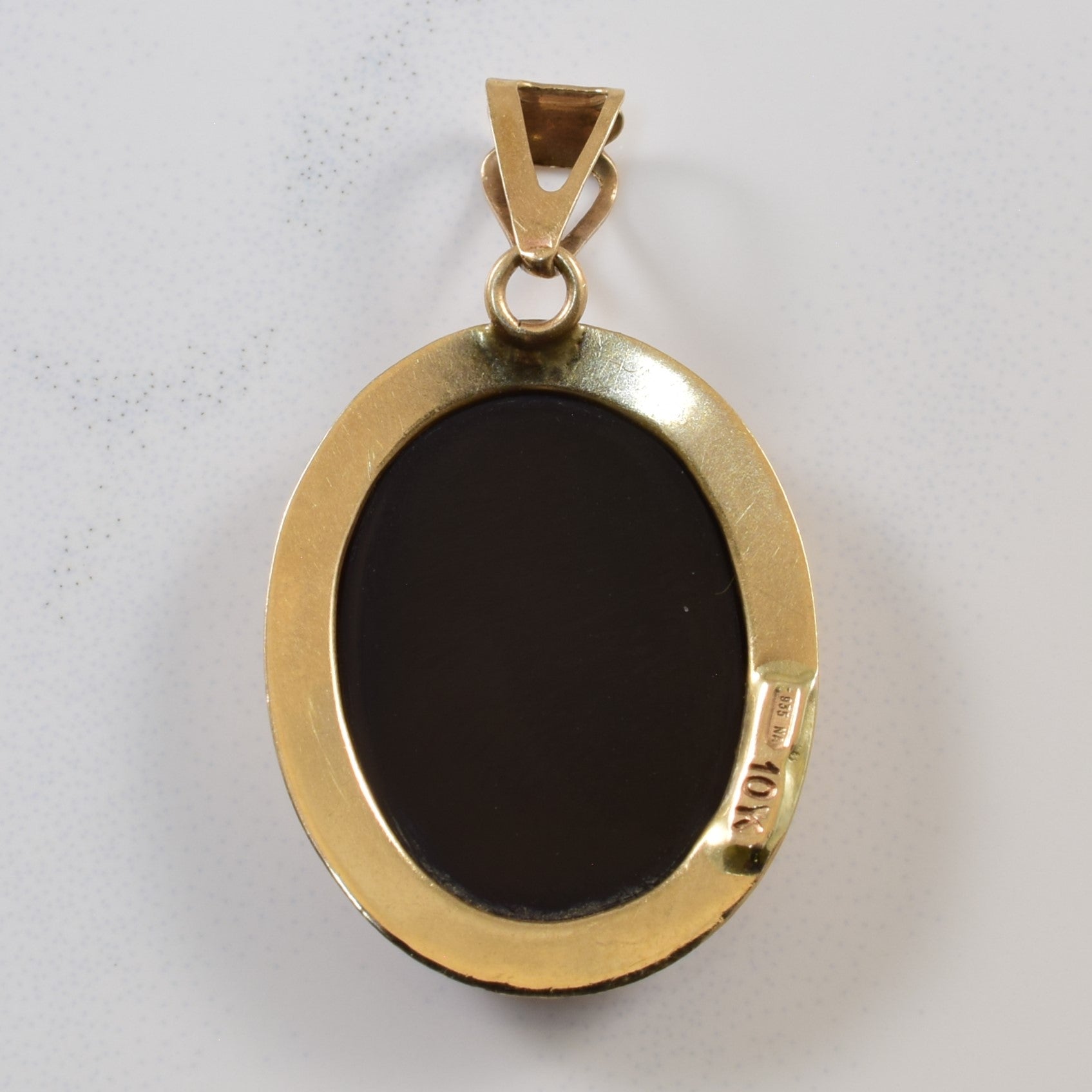 Pendentif camée chérubin en onyx | 4,50 ct |