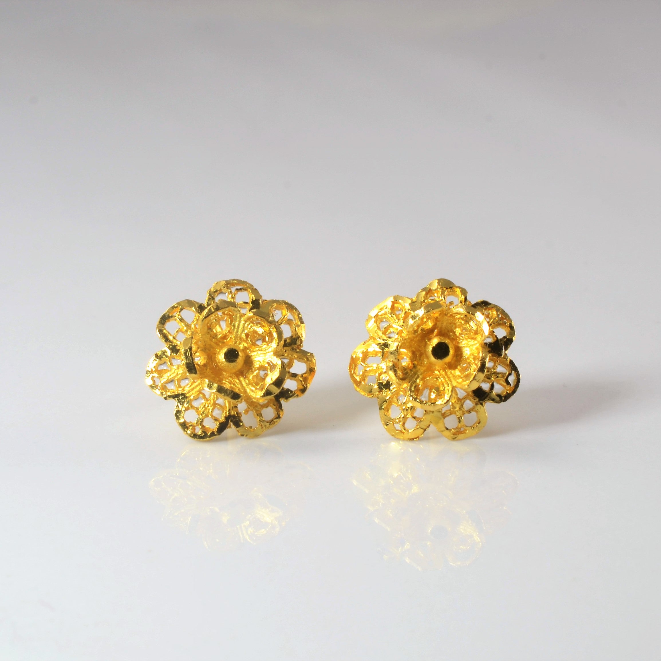 Boucles d'oreilles en or jaune 24 carats en forme de fleur |