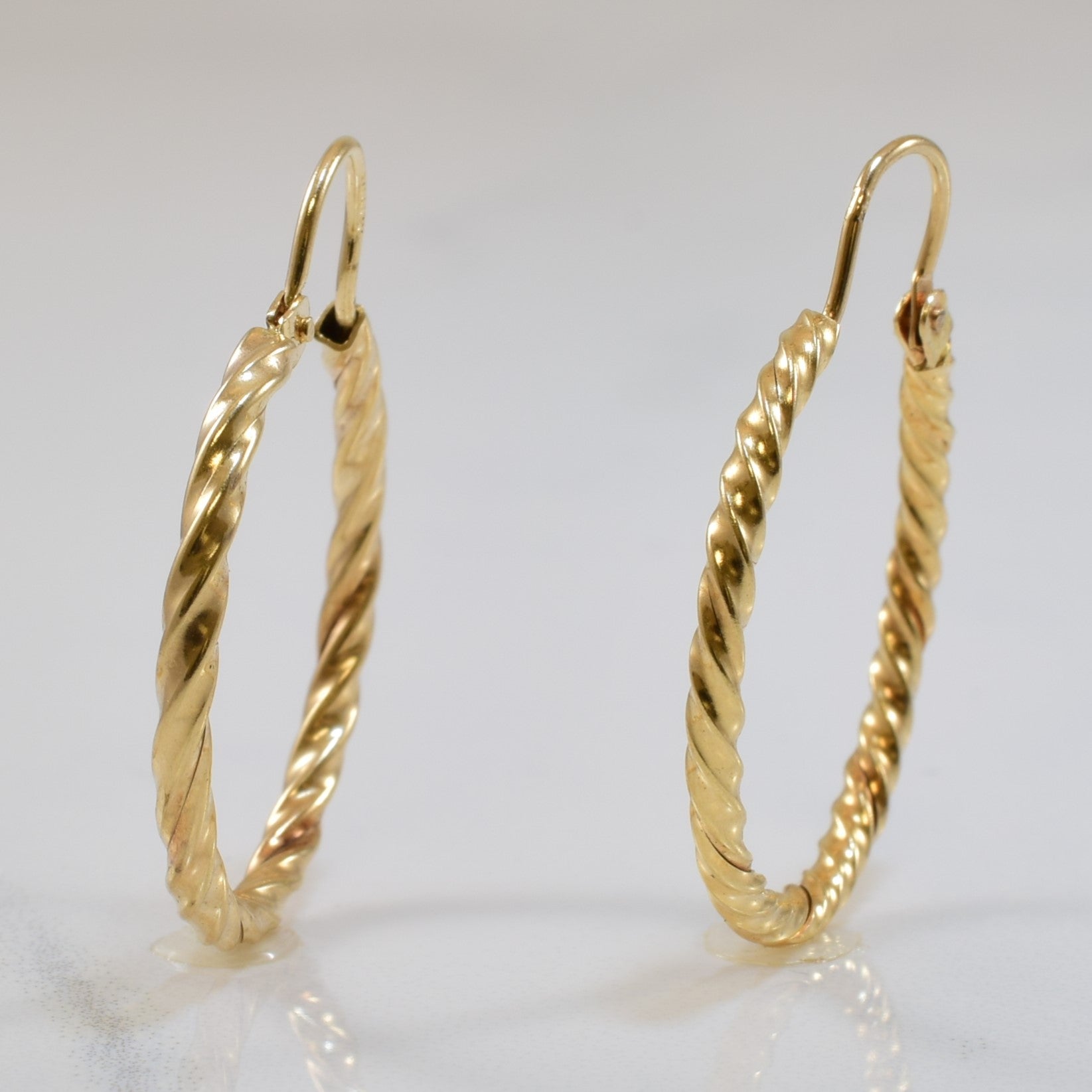 Boucles d'oreilles créoles torsadées en or jaune 10 carats |