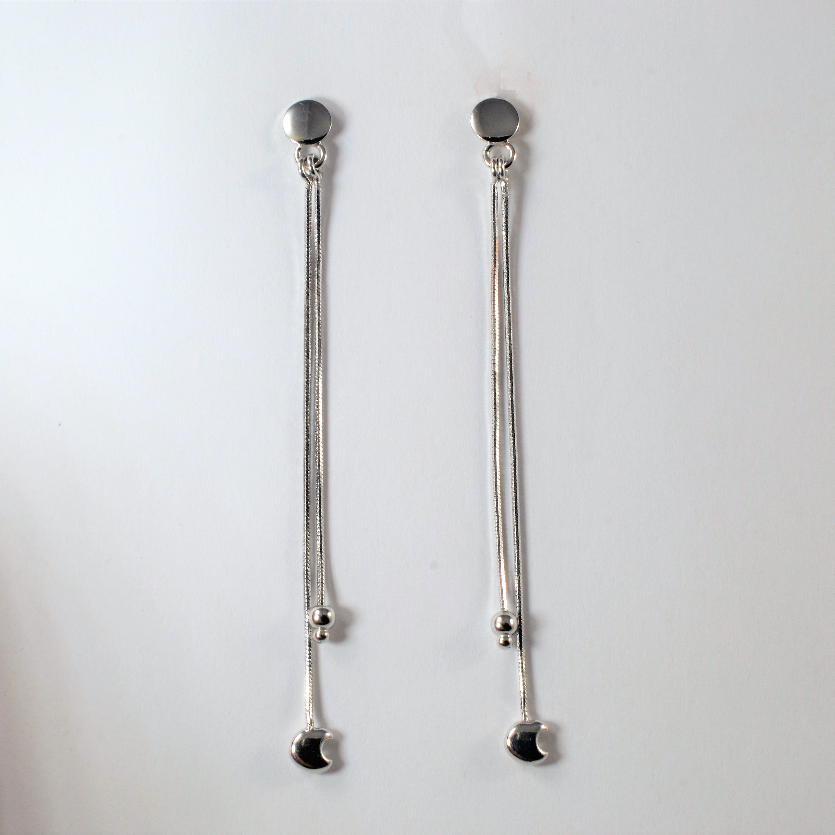 Boucles d'oreilles pendantes demi-lune en or blanc |