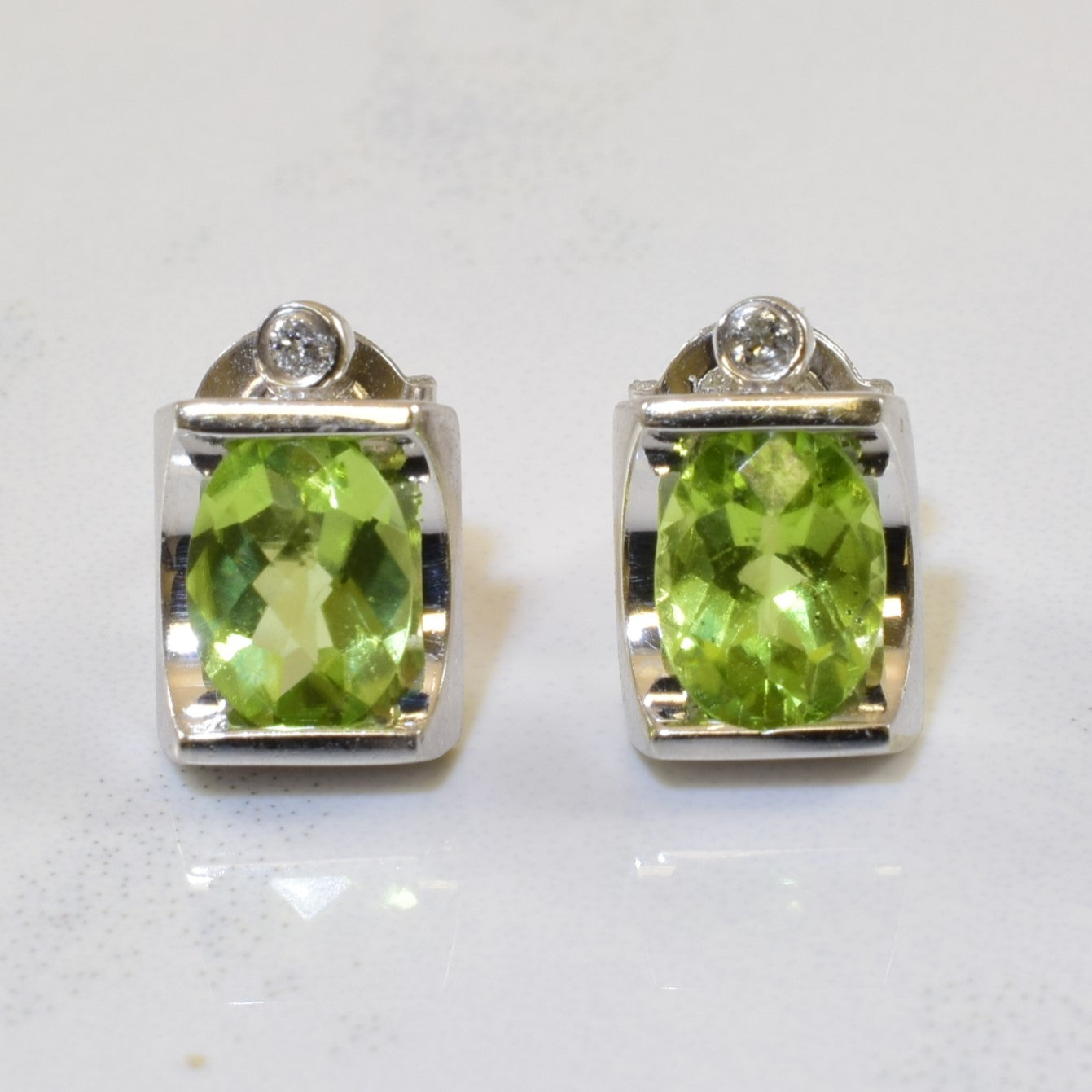 Tension Set Peridot & Diamond Stud Earrings | 1.40ctw, 0.02ctw |