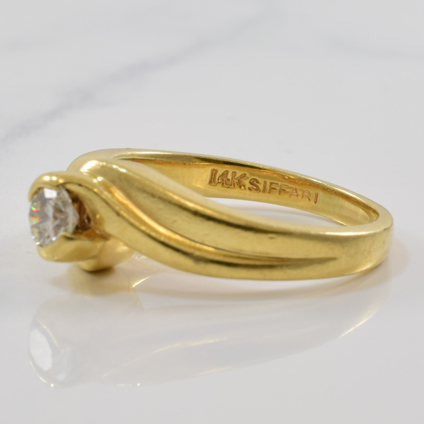 Bague solitaire diamant avec serti contourné | 0,23 ct | Taille 4,5 |