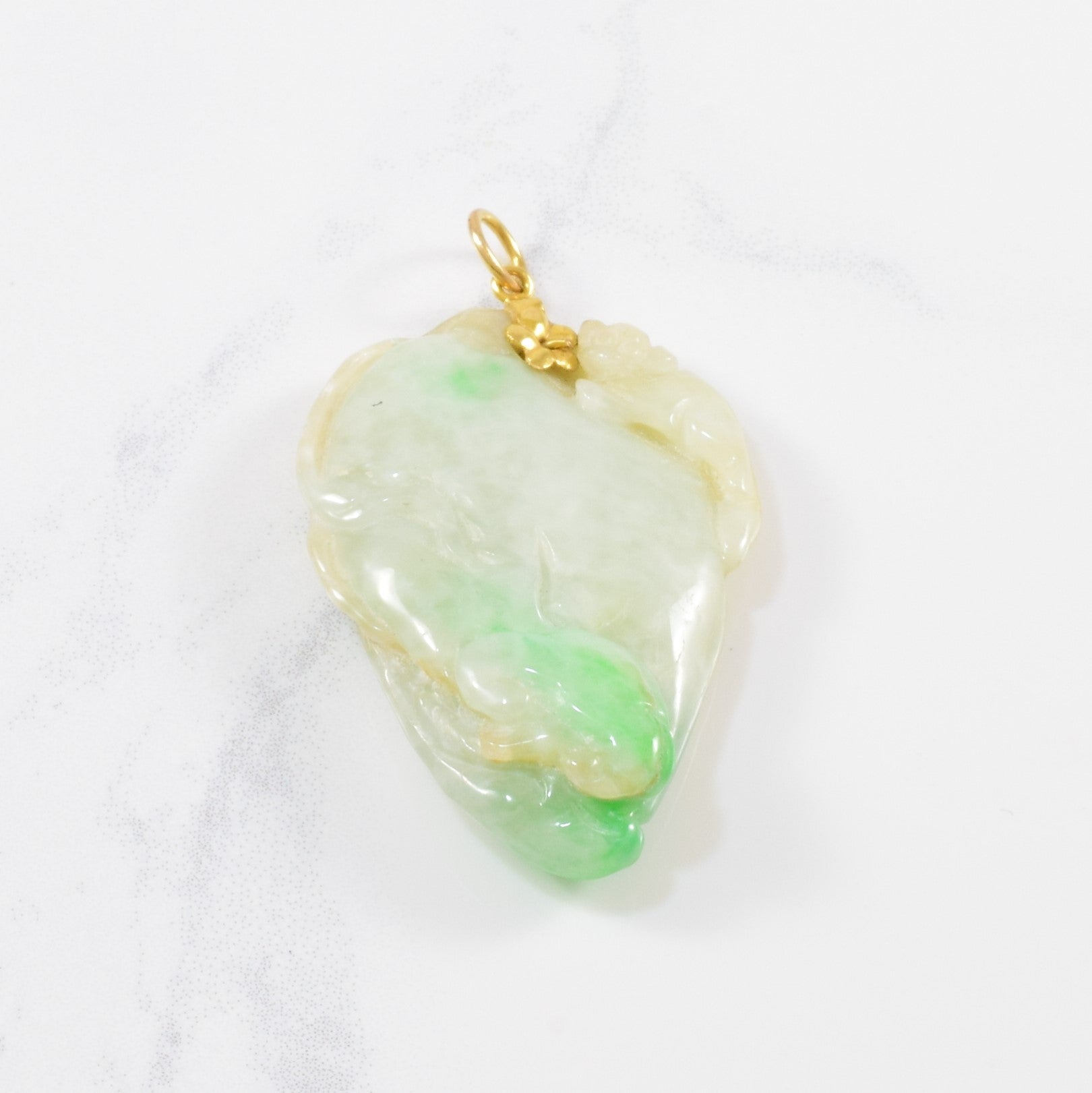 Carved Jadeite Pendant | 80.00 ct |