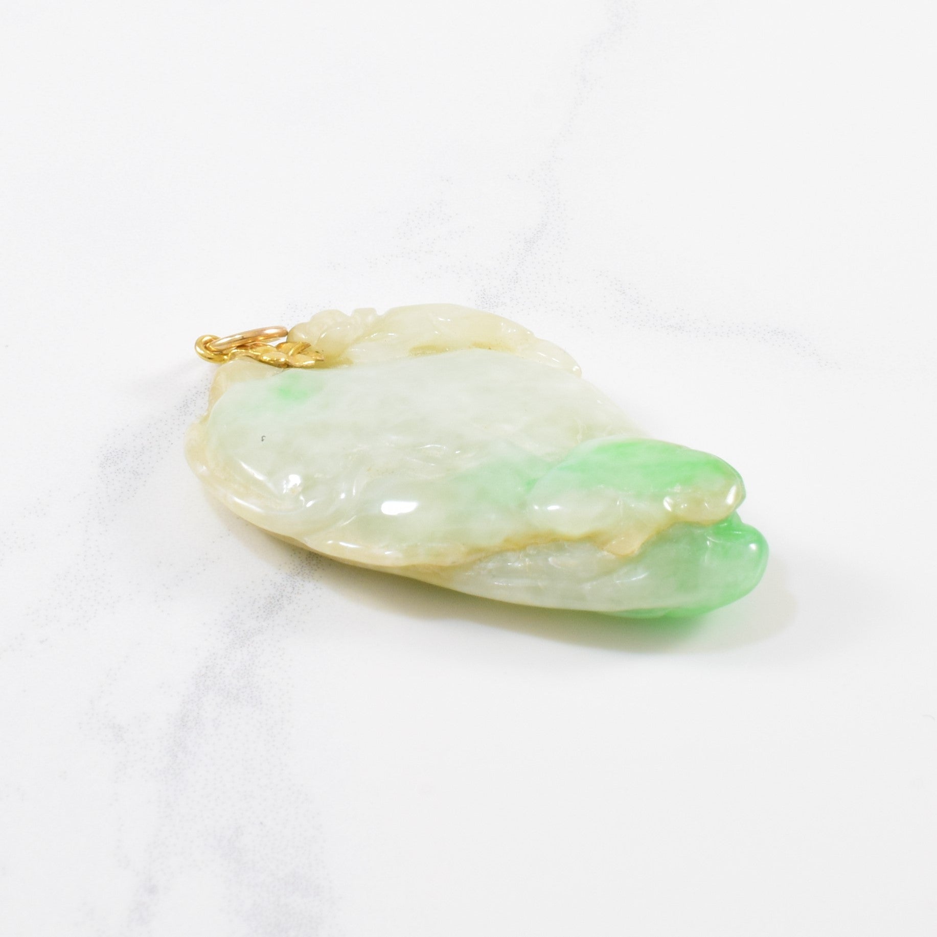 Carved Jadeite Pendant | 80.00 ct |
