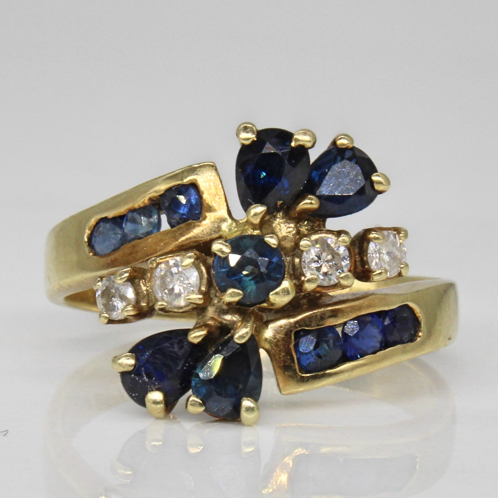 Unique Sapphire & Diamond Bypass Ring | 0.72ctw, 0.12ctw | SZ 8 |